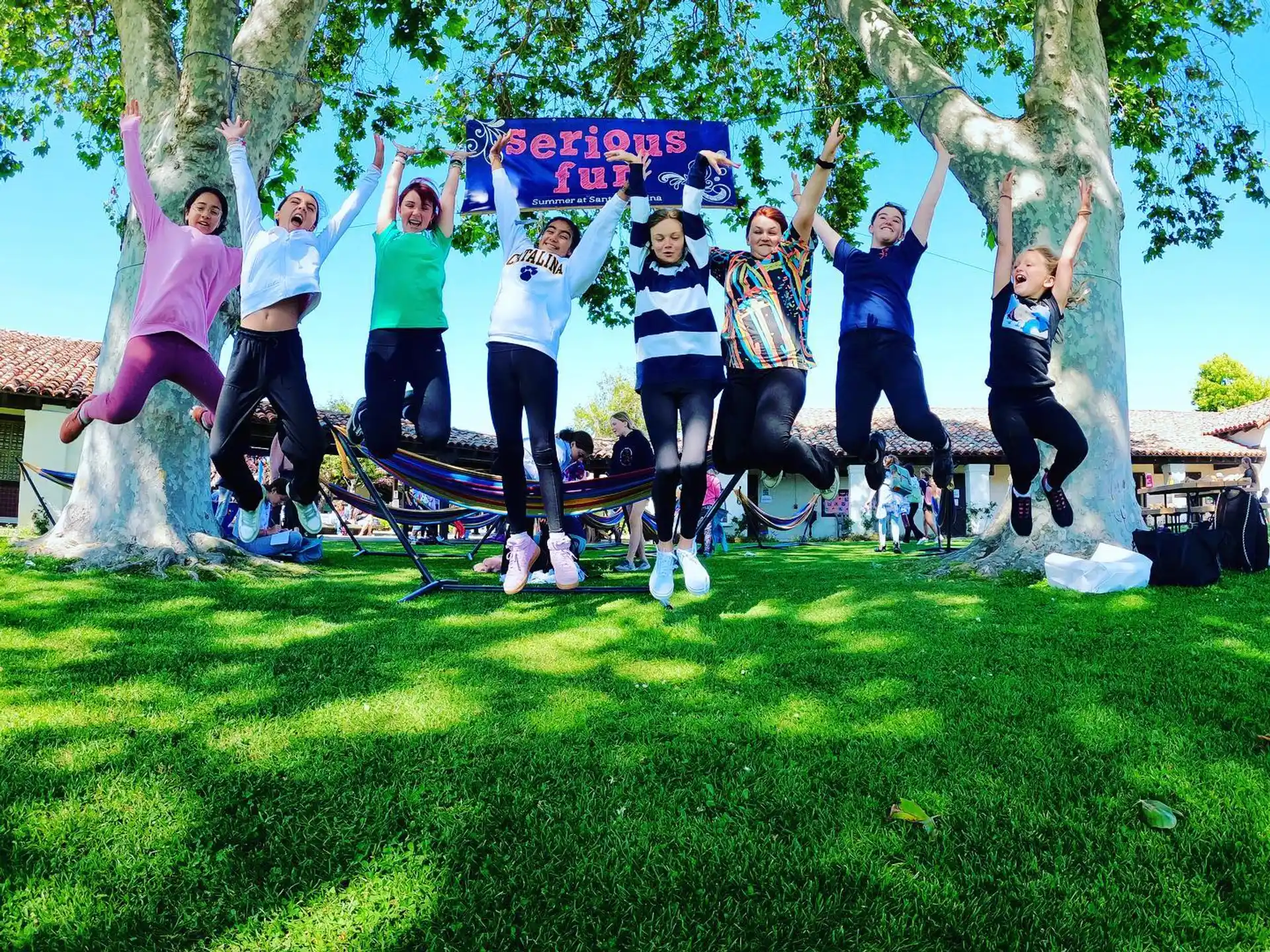 a group of people jumping in the air