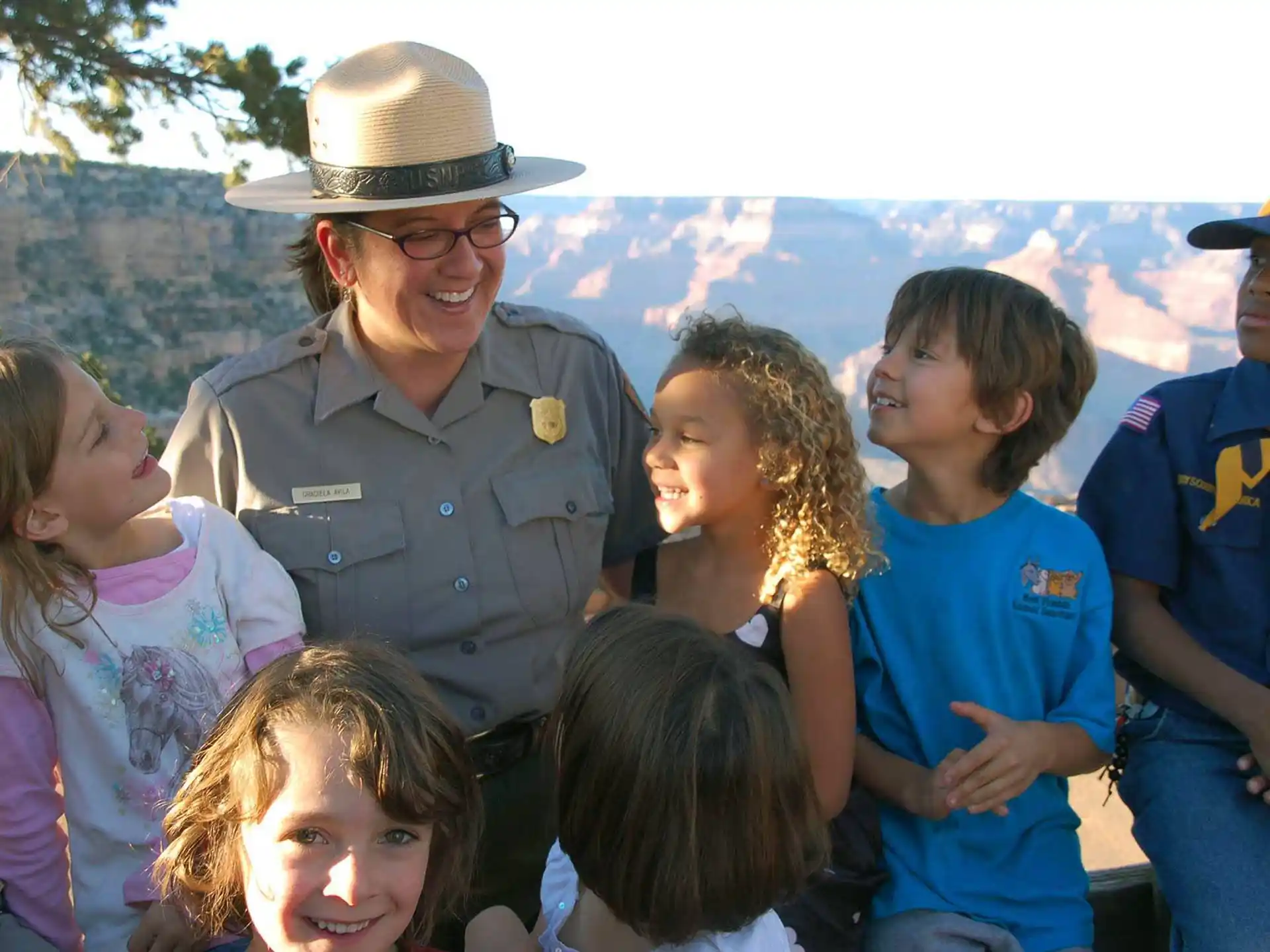 a person with a hat and a group of children