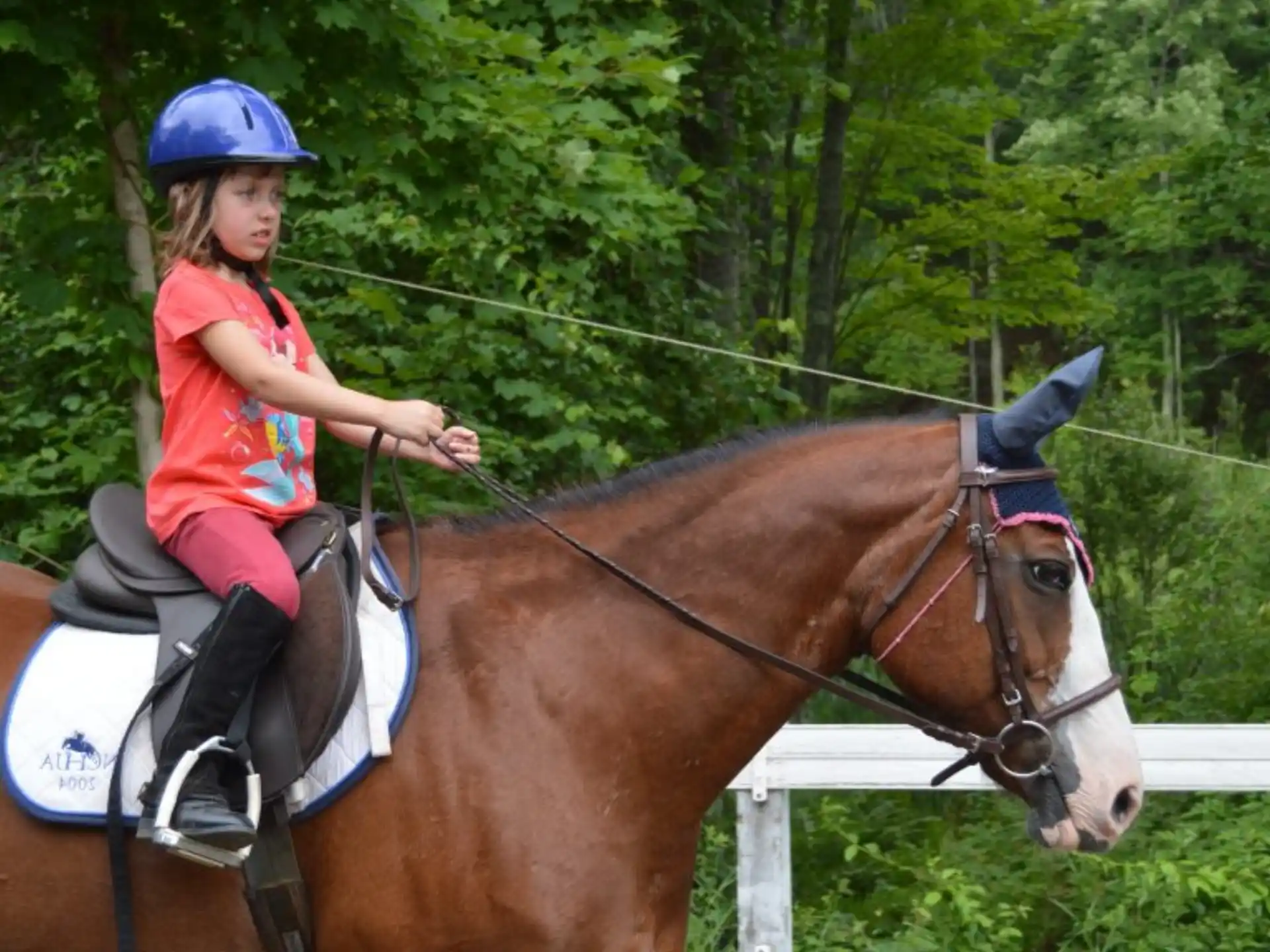 a girl riding a horse