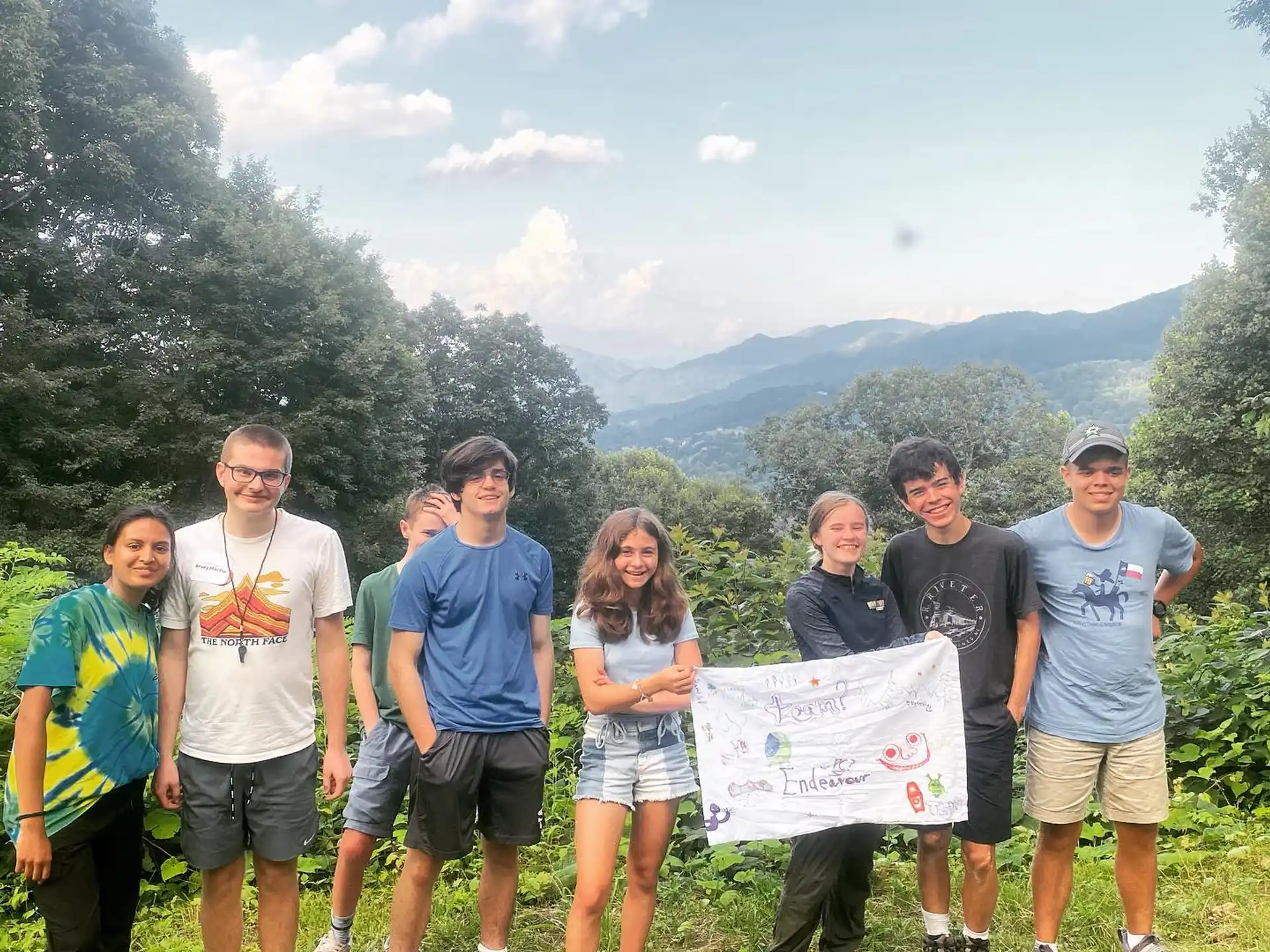 a group of people holding a sign