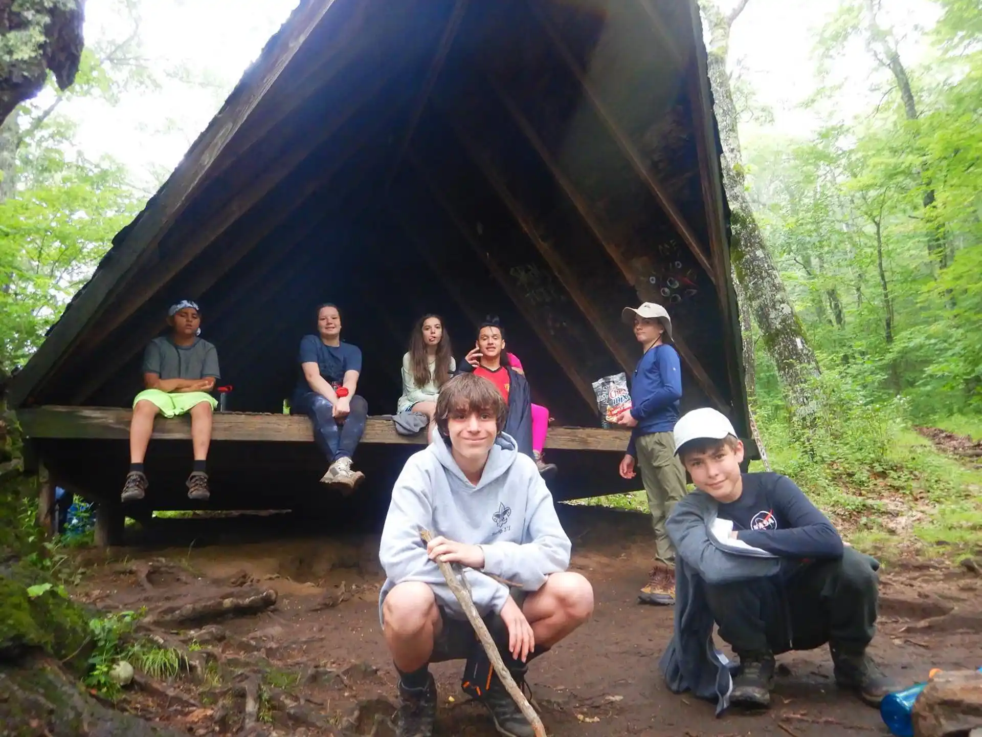 a group of people sitting under a tent