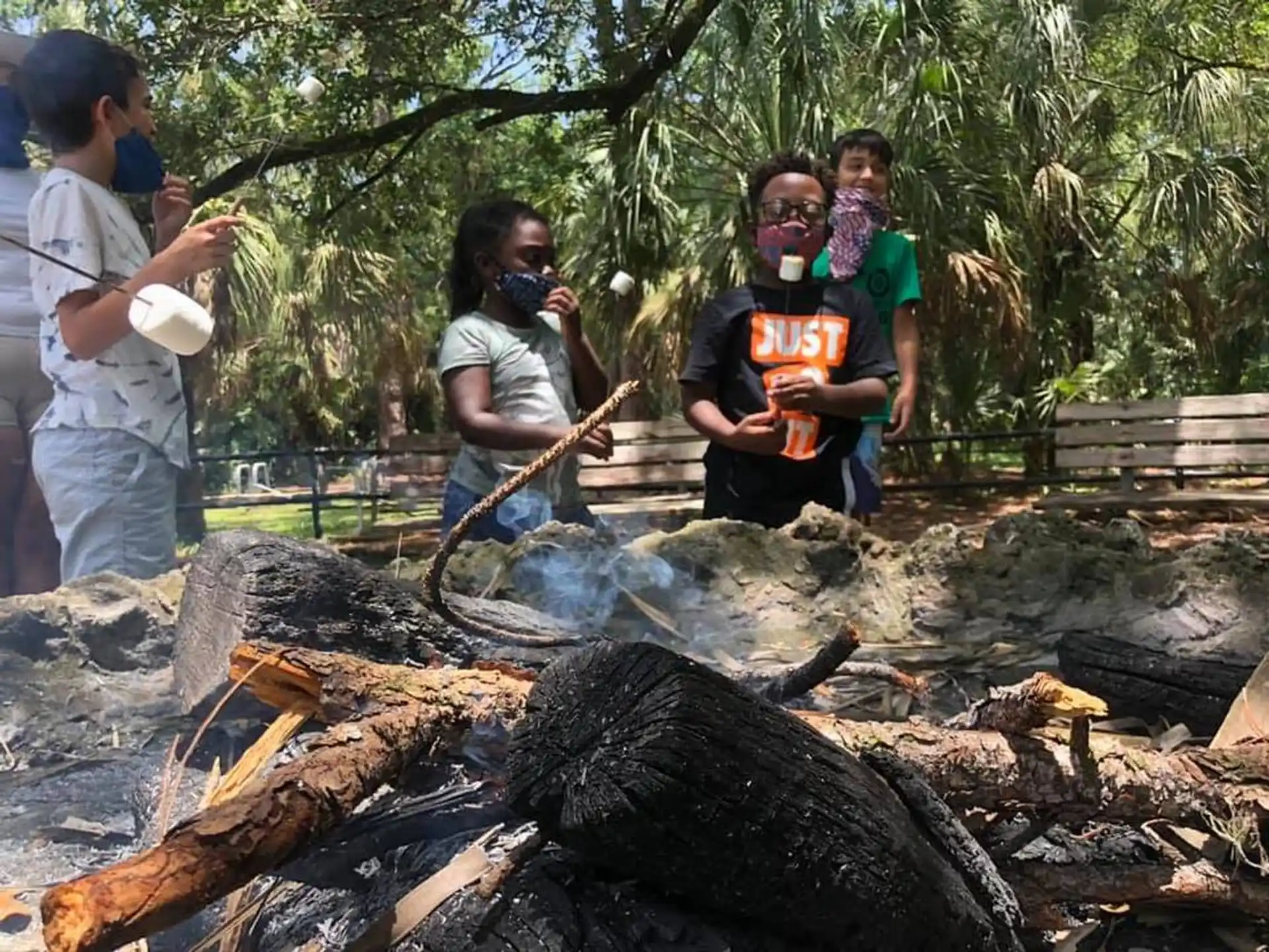 a group of people around a fire