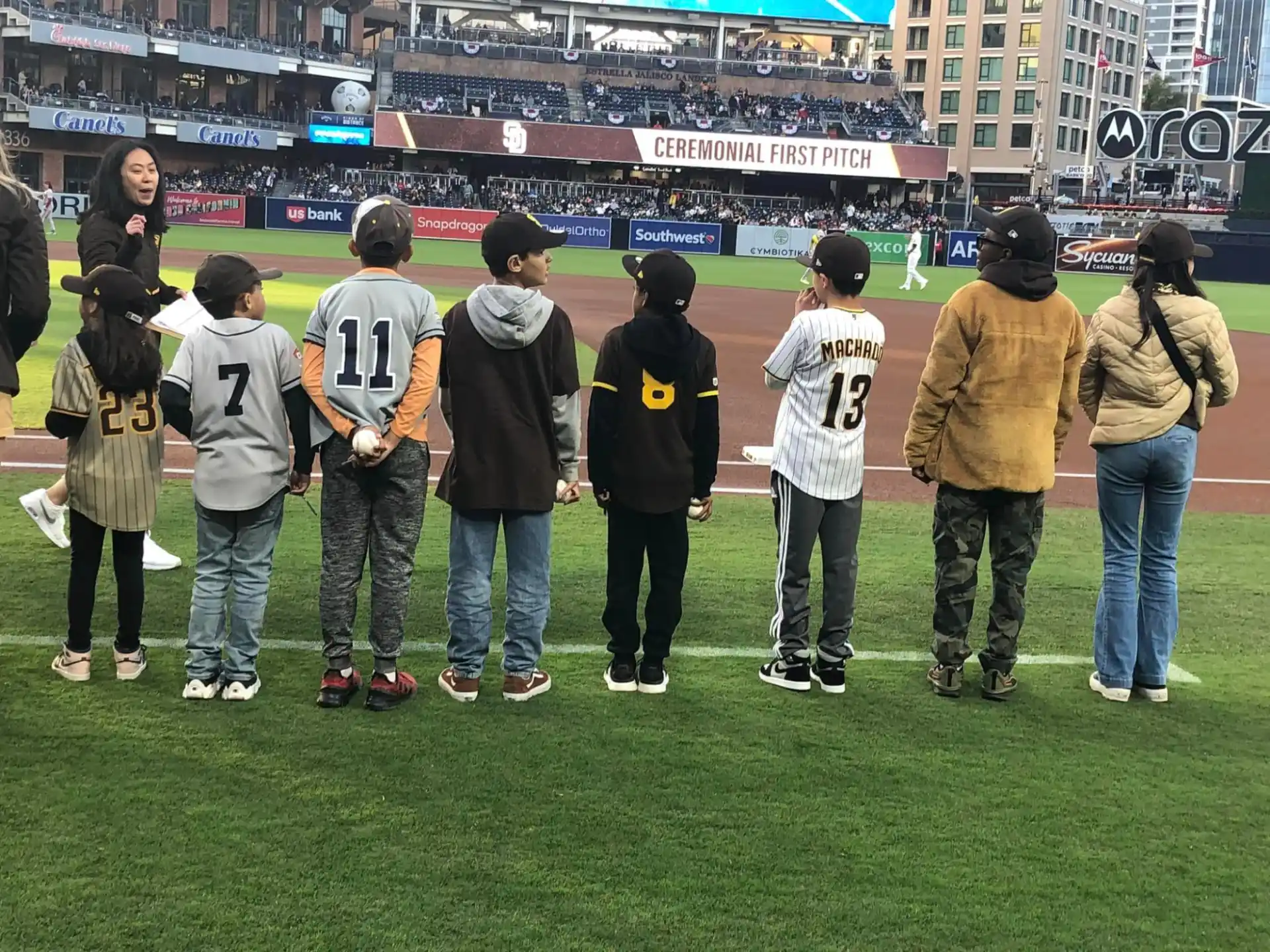 a group of people standing on a field