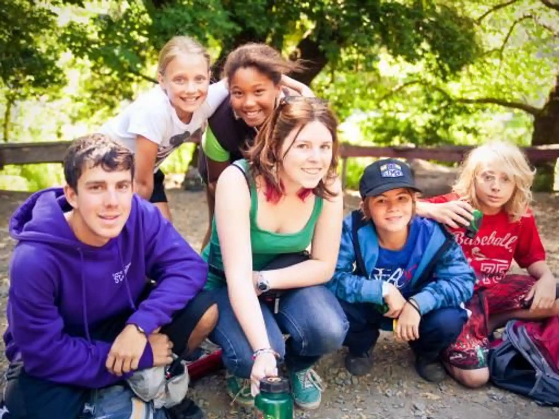 a group of people sitting on a bench