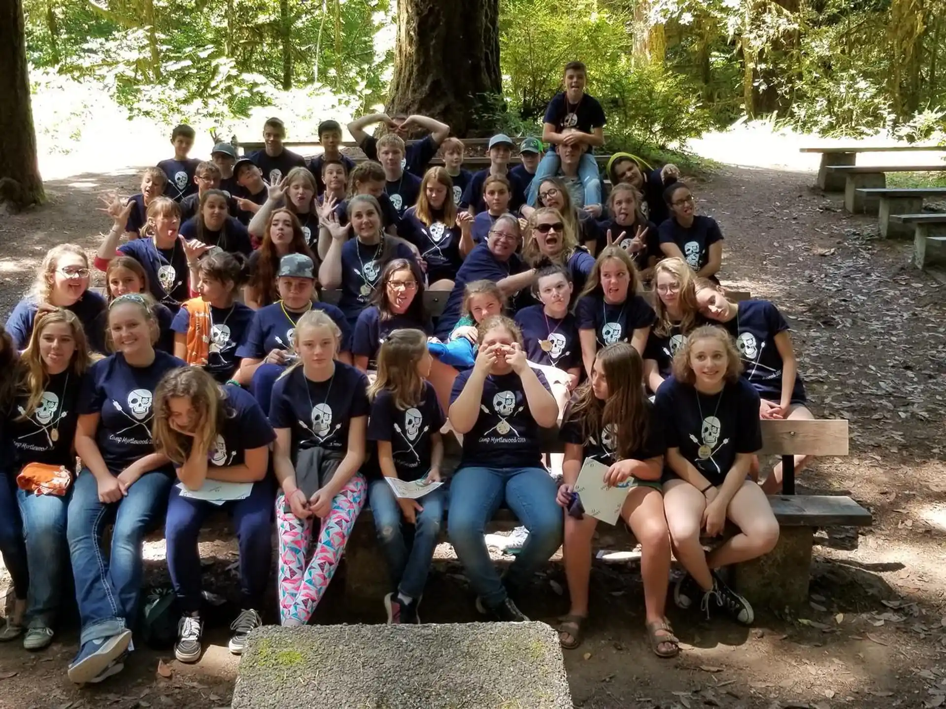 a group of people sitting on a bench