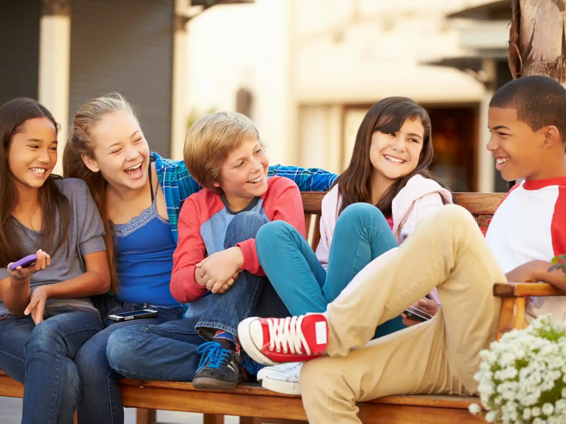 a group of people sitting together smiling