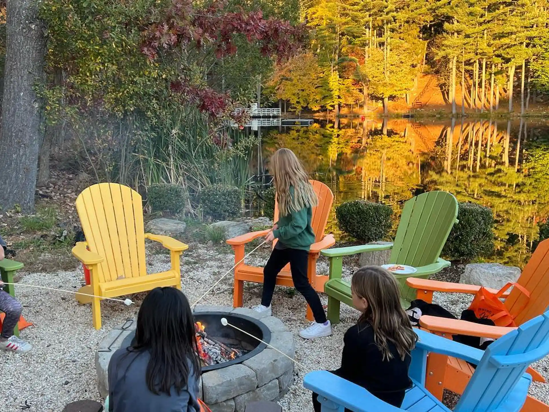 a group of people sitting in chairs outside