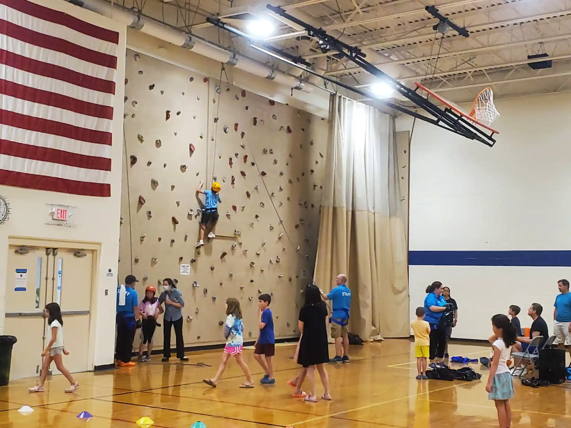 a group of people playing basketball