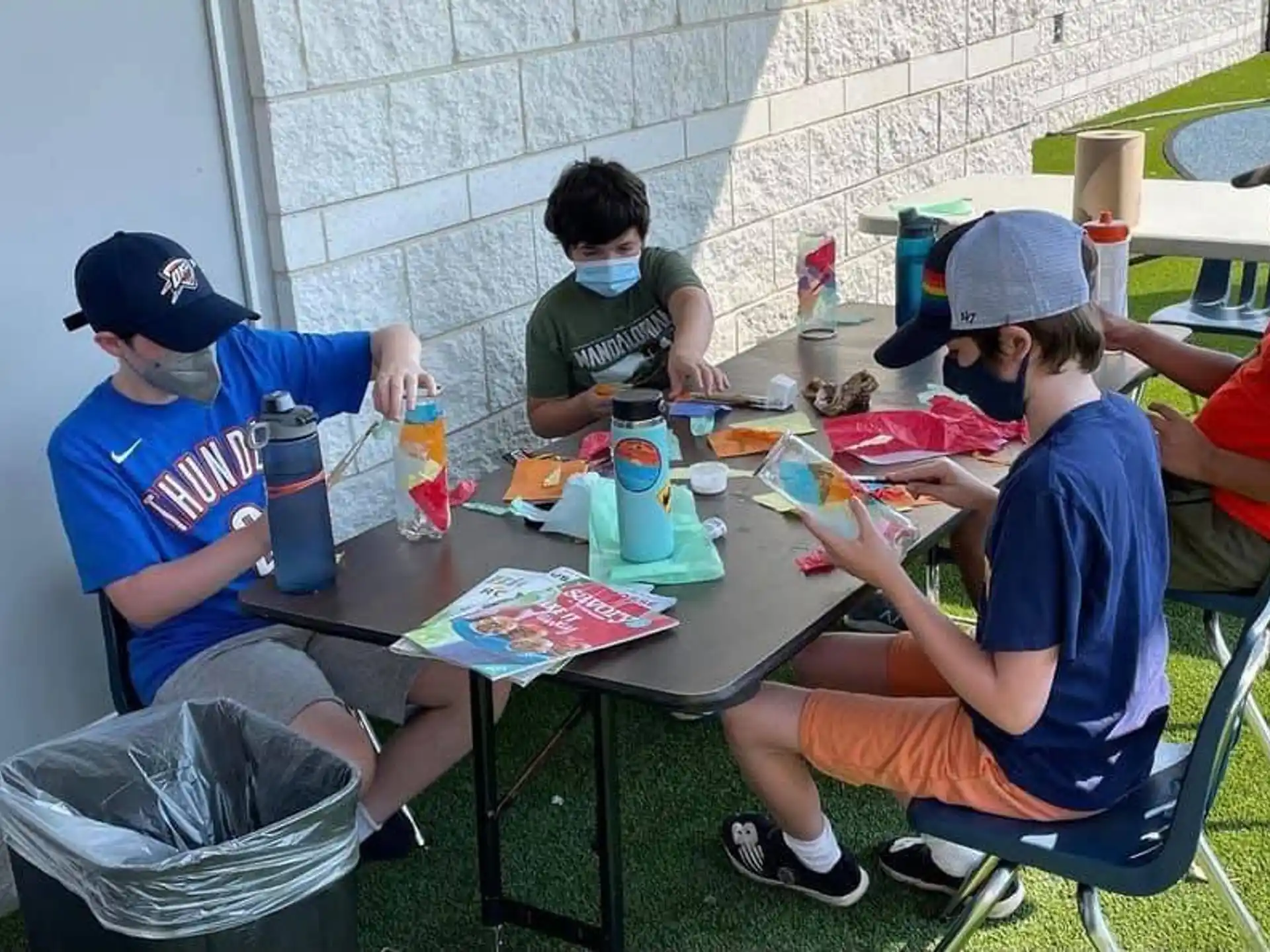 a group of people sitting around a table