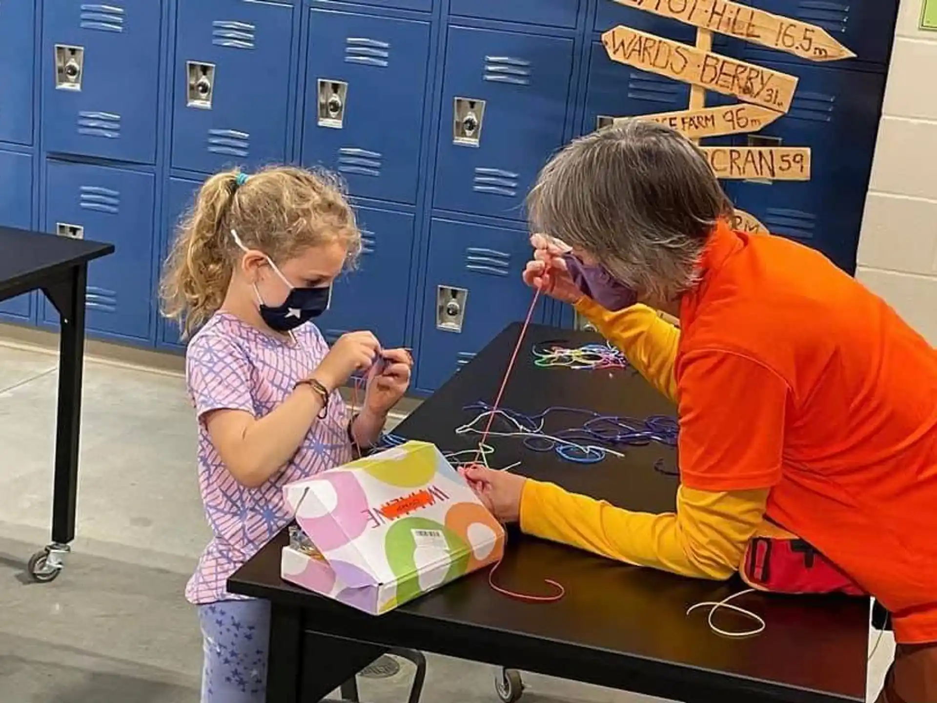 a person and a girl with a string of string