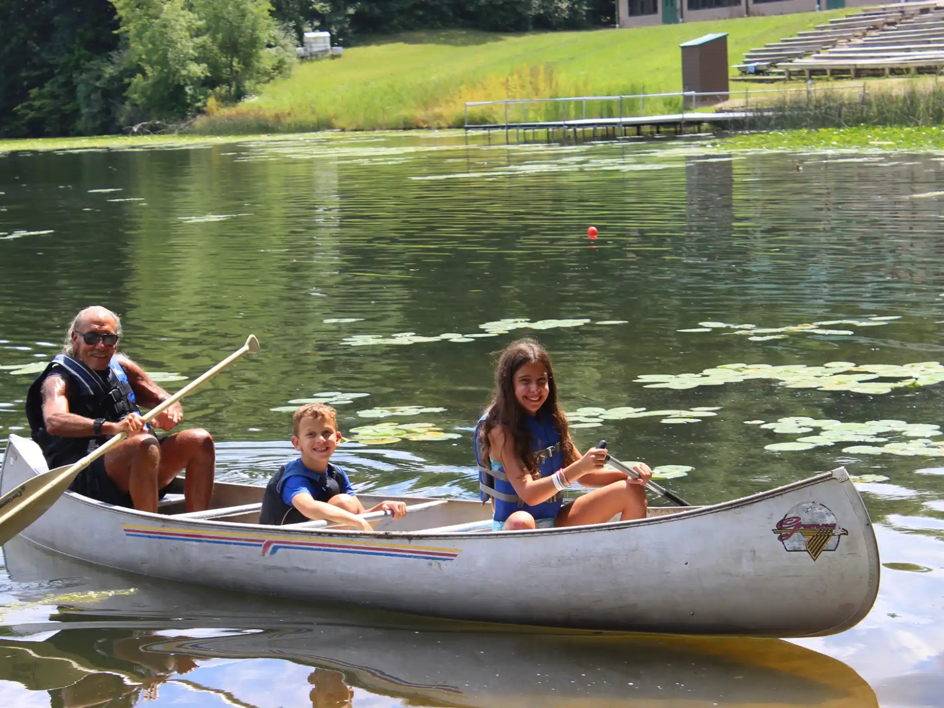 a group of people in a canoe