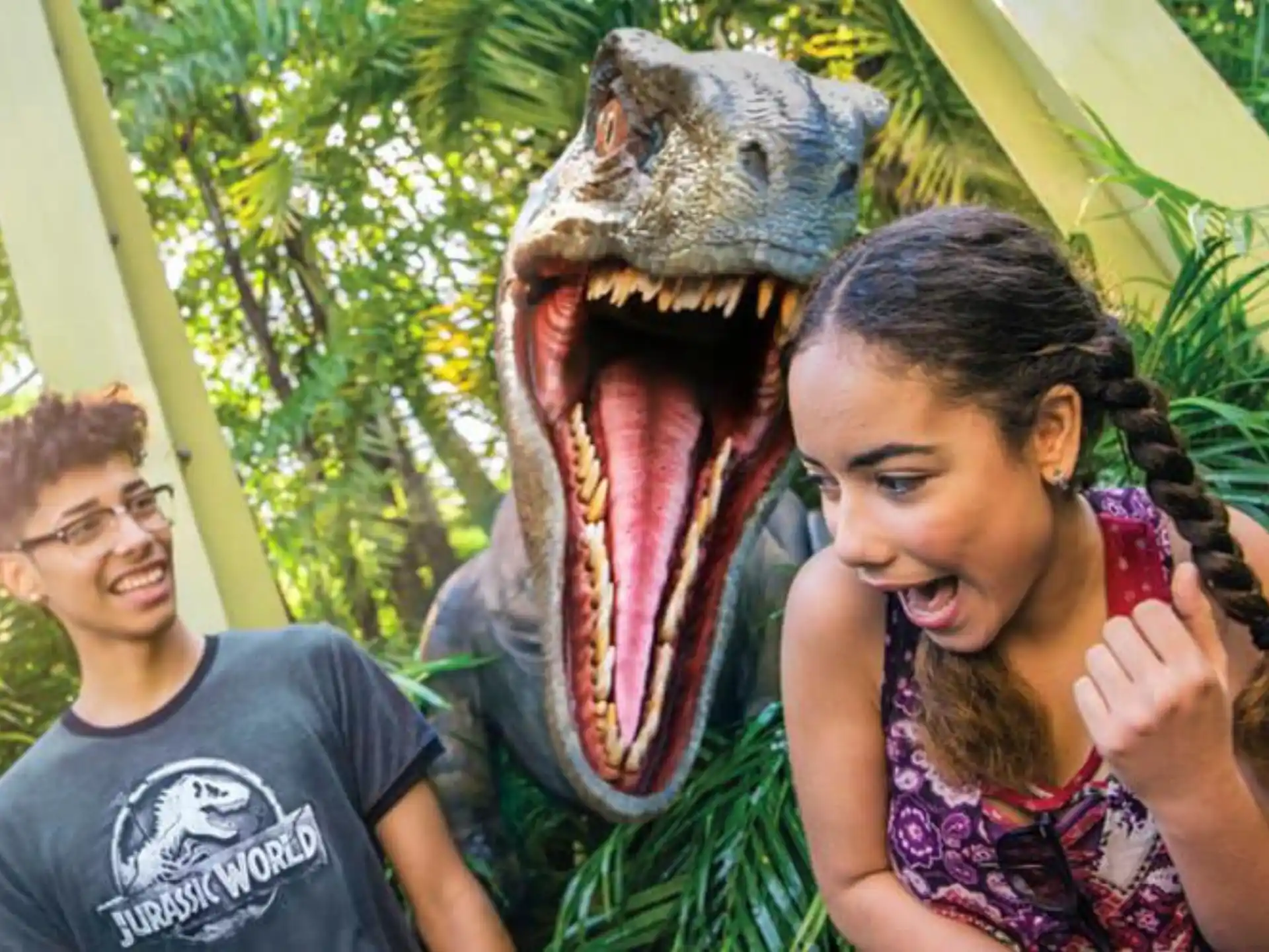 a dinosaur with a woman and a man