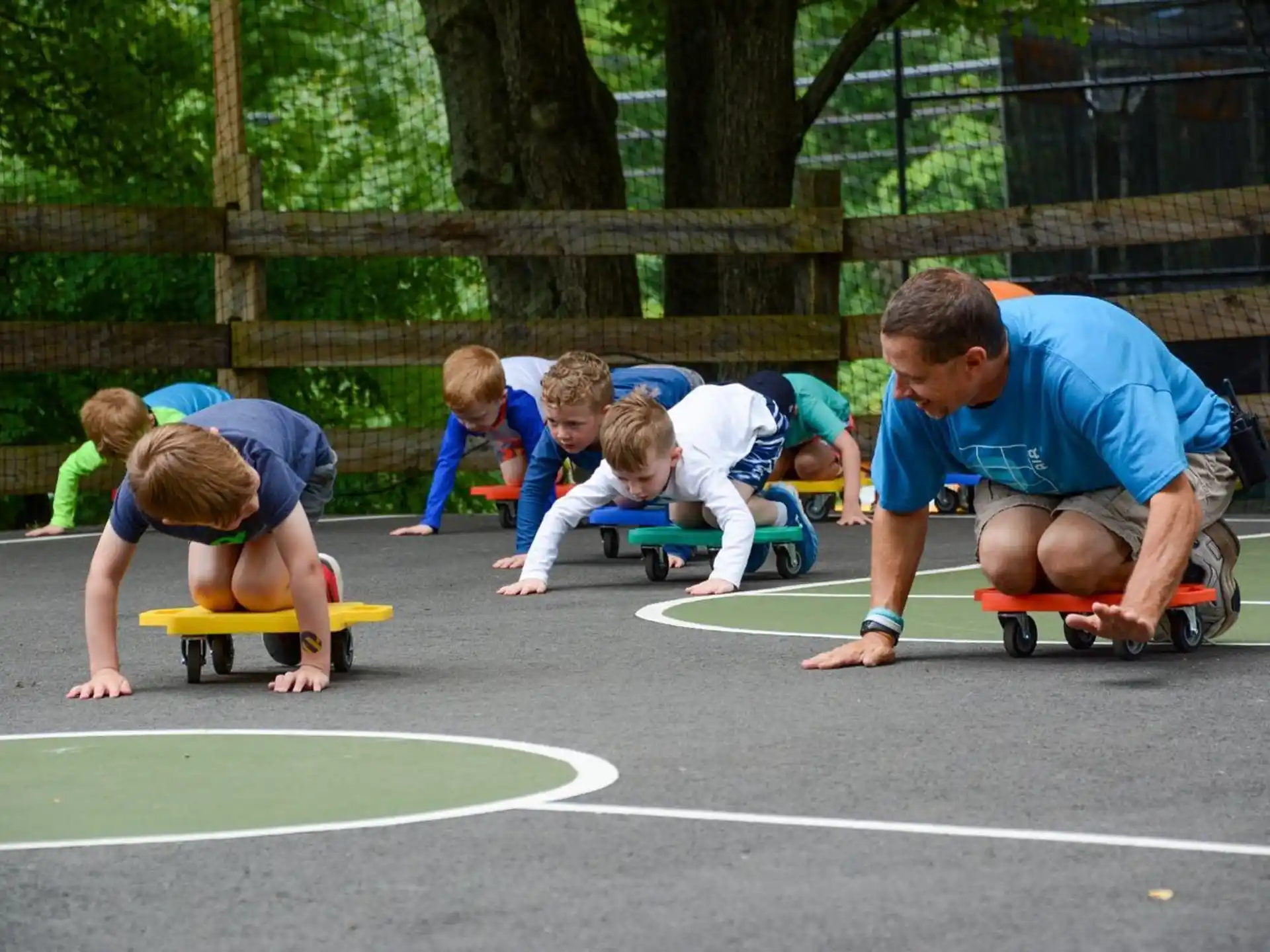 a person pushing kids on skateboards