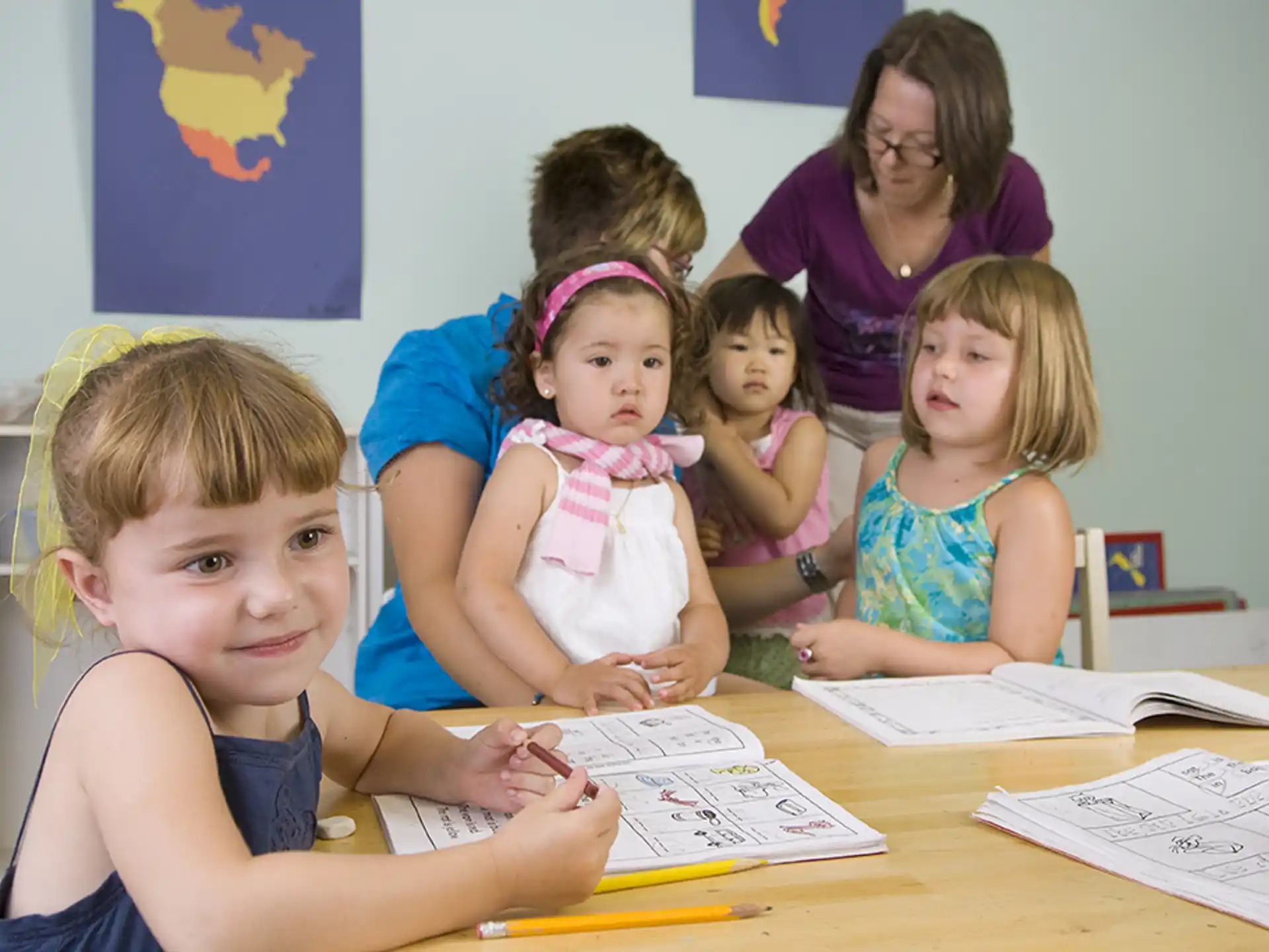 a group of children sitting at a table