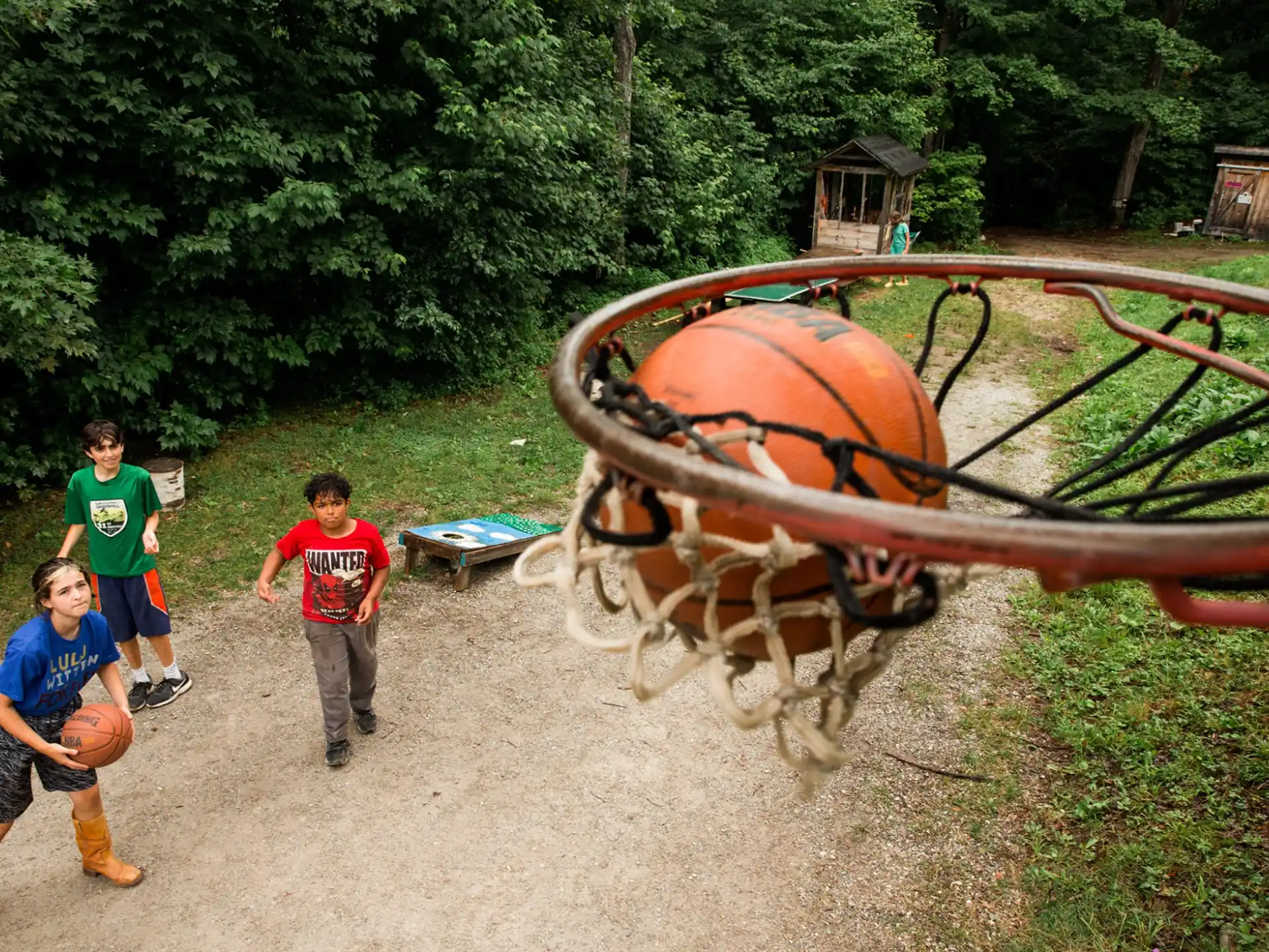 a group of boys playing basketball