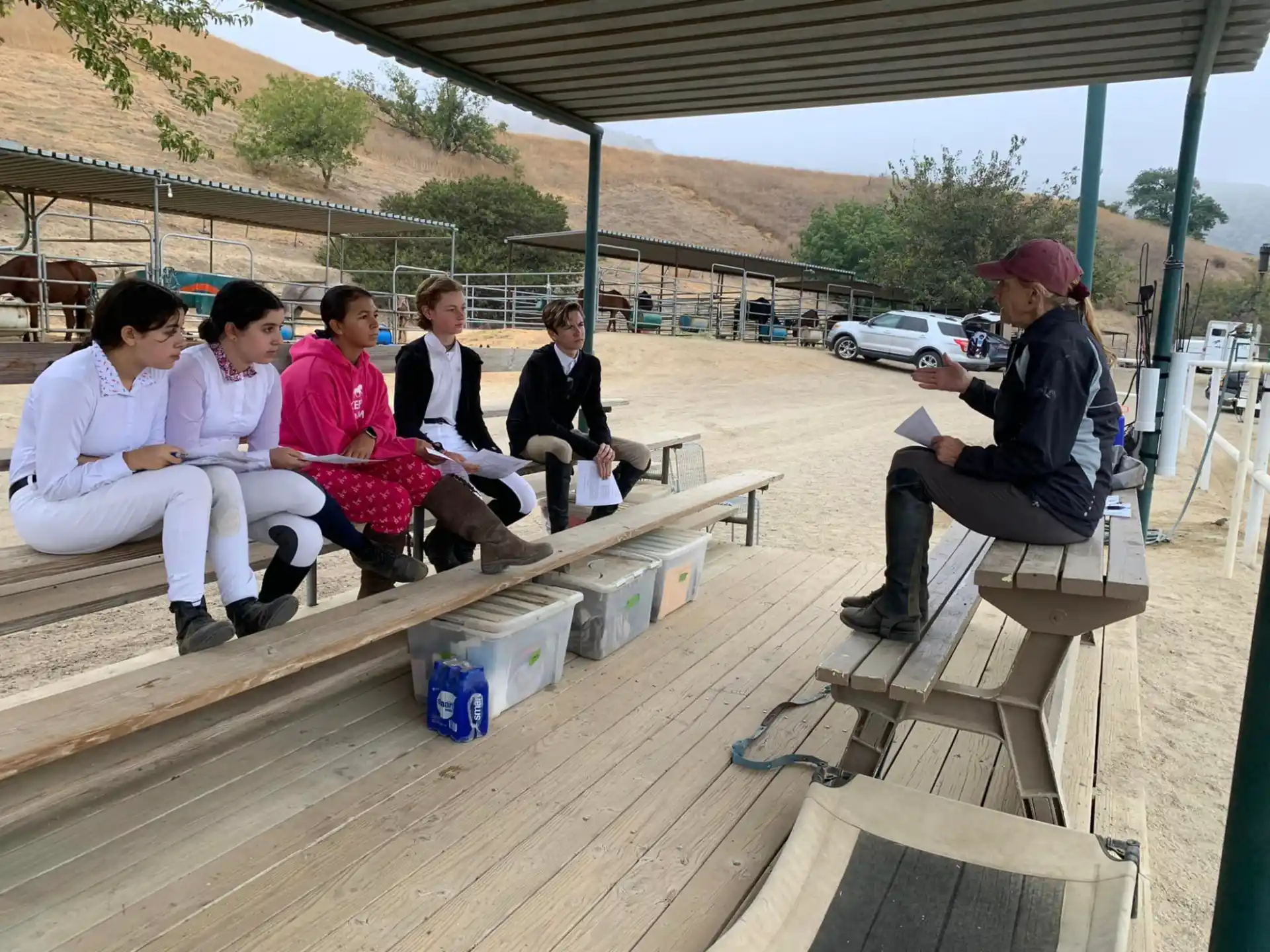 a group of people sitting on a bench