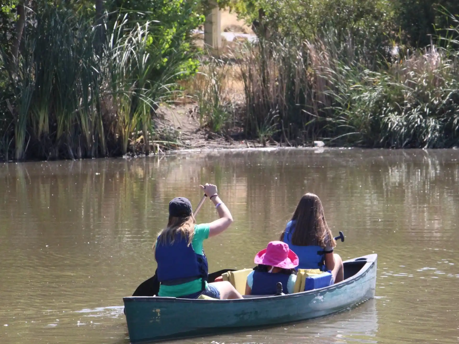 a group of people in a canoe