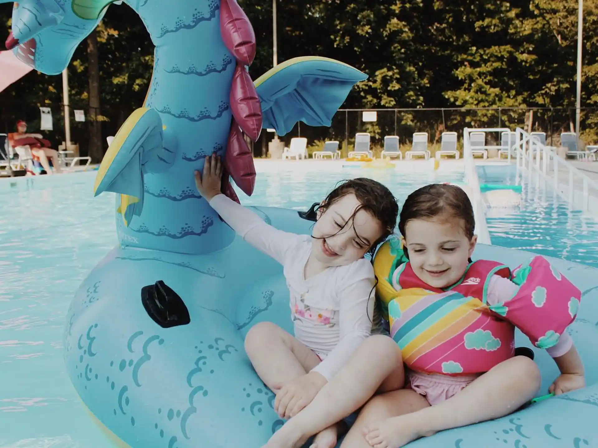 a person and a child in a pool