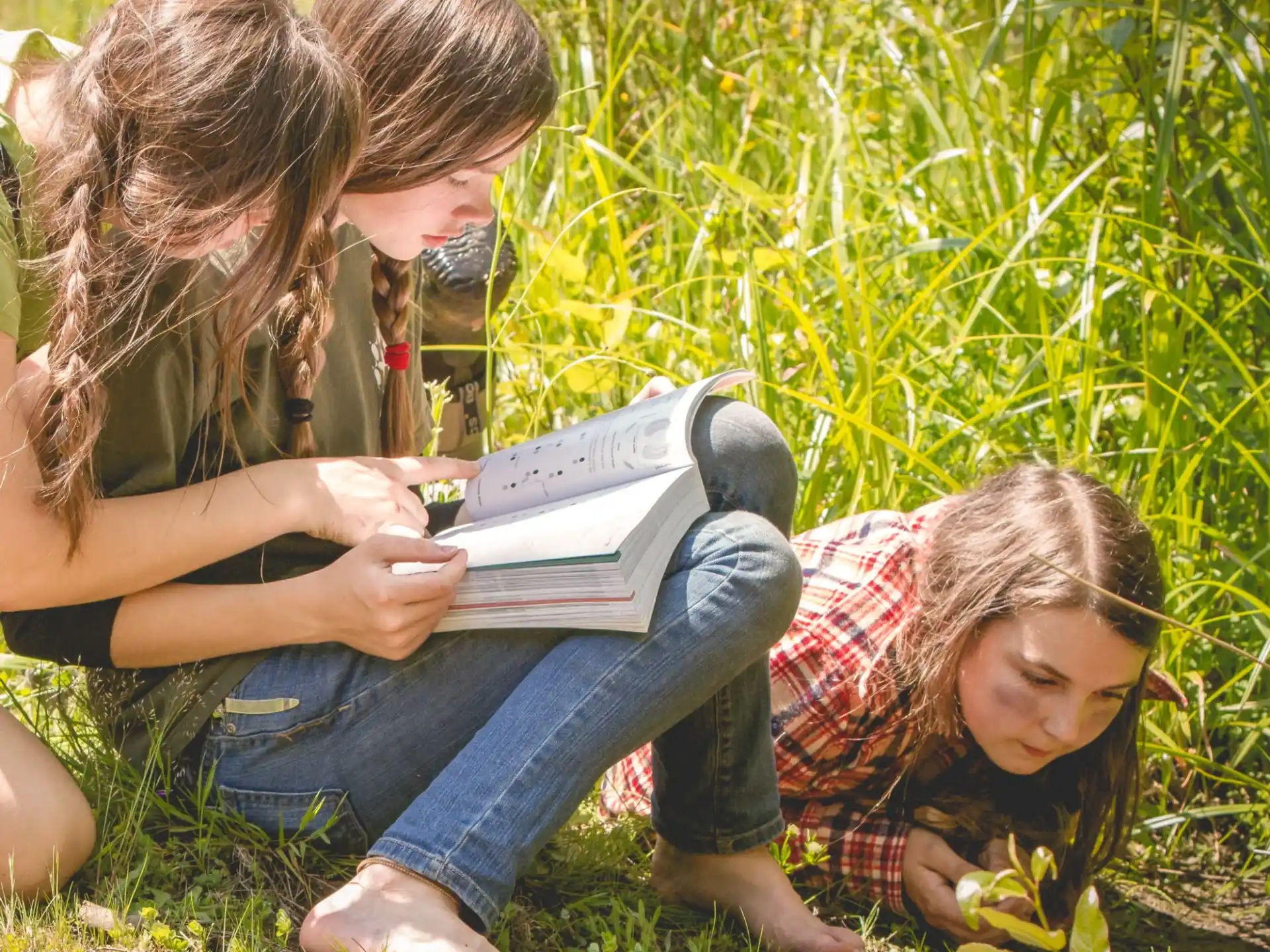 a group of women reading a book