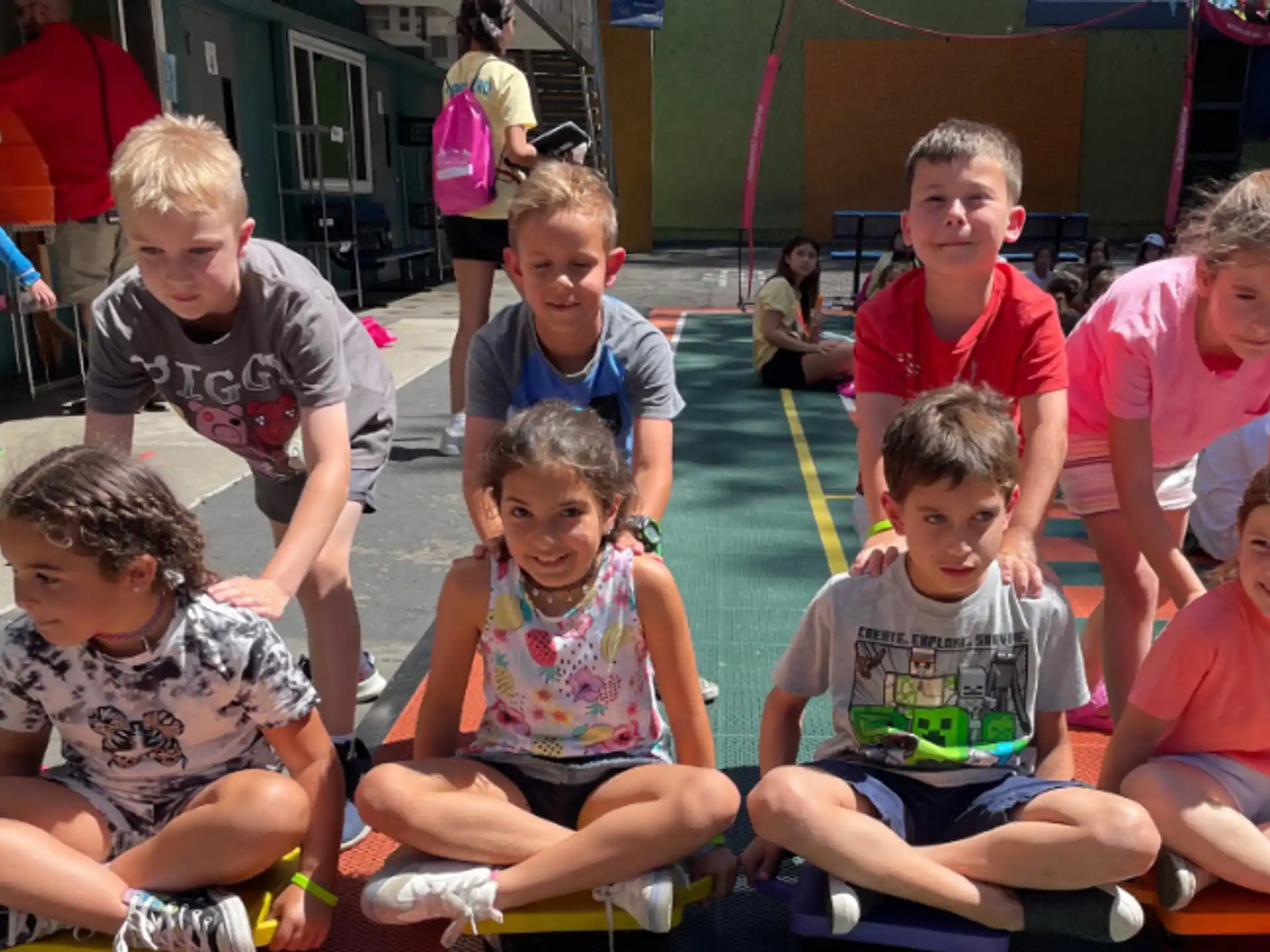 a group of children sitting on the ground