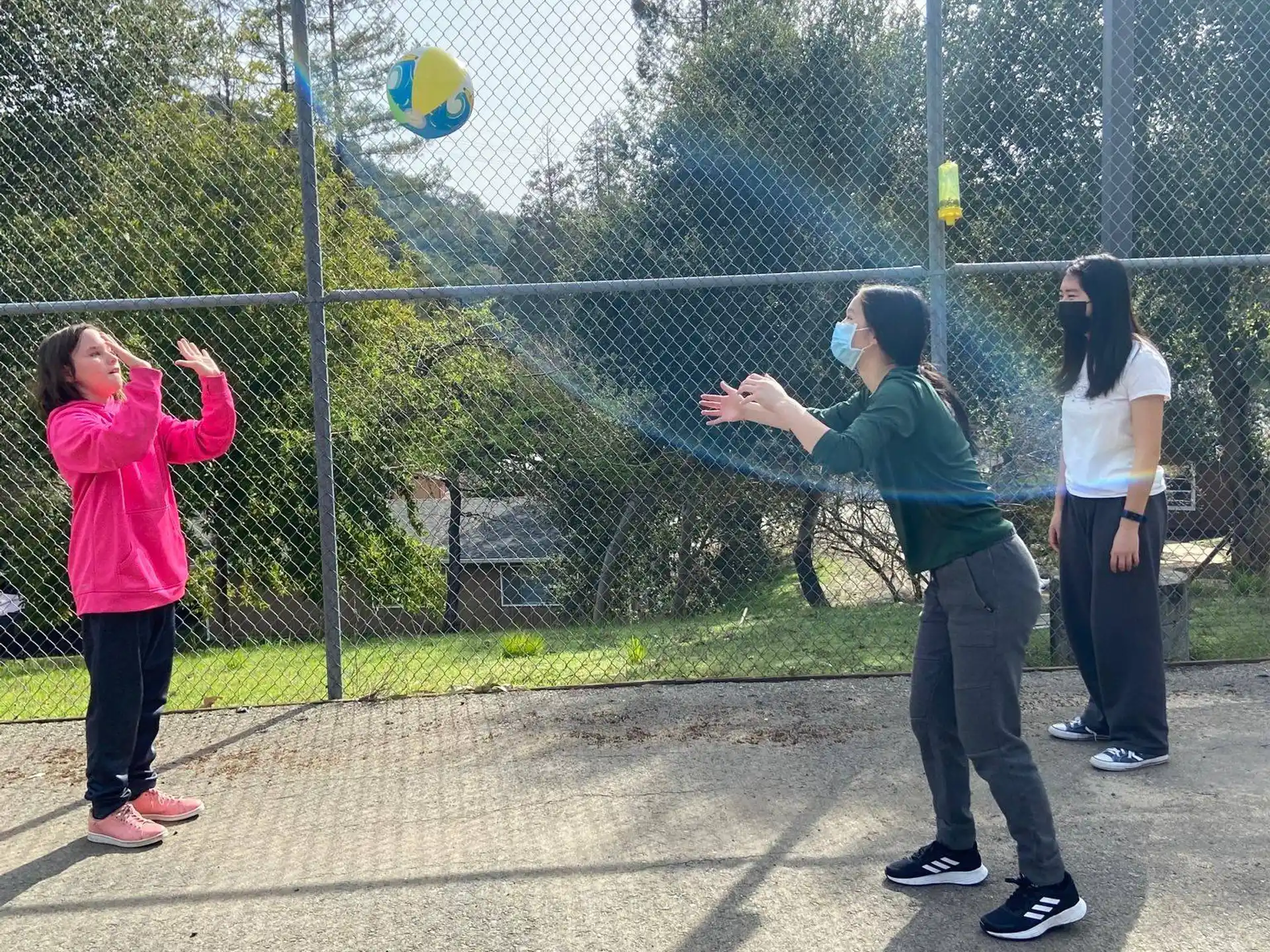 a group of people playing frisbee