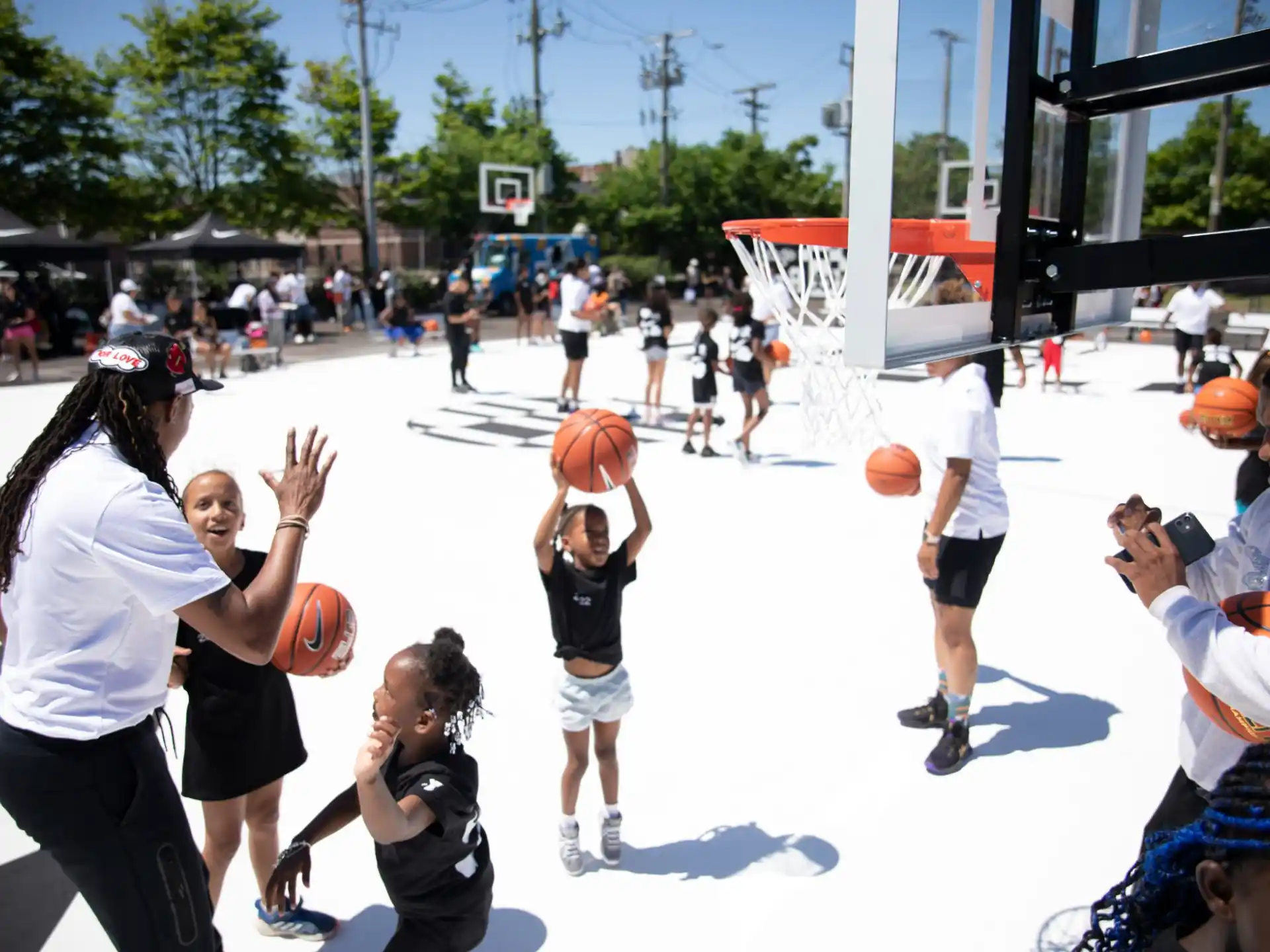 a group of people playing basketball
