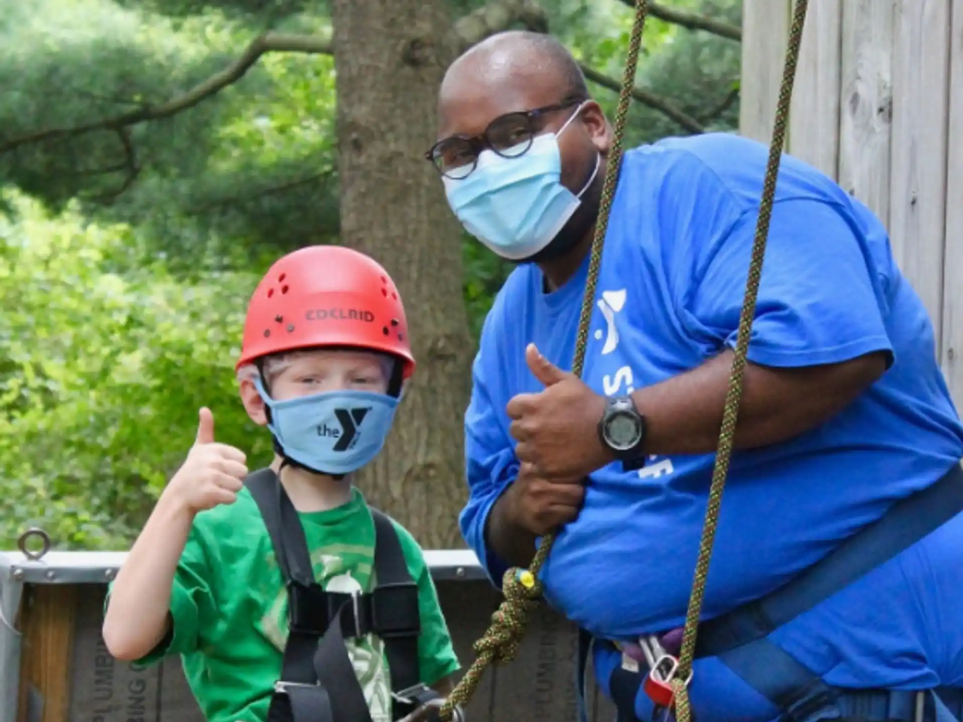 a person and a boy wearing helmets
