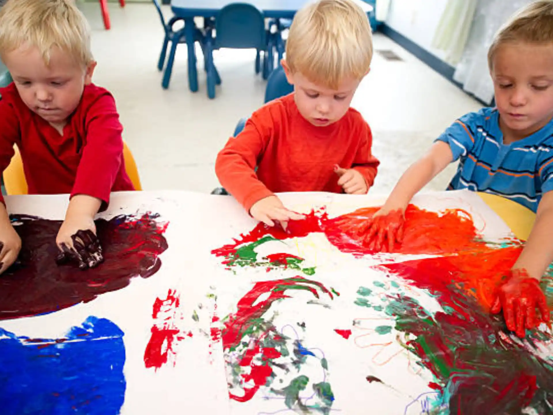 a group of children painting