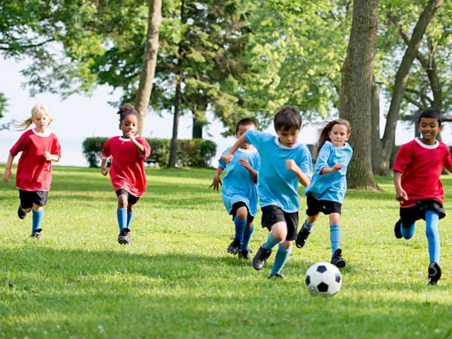 kids playing football on a field
