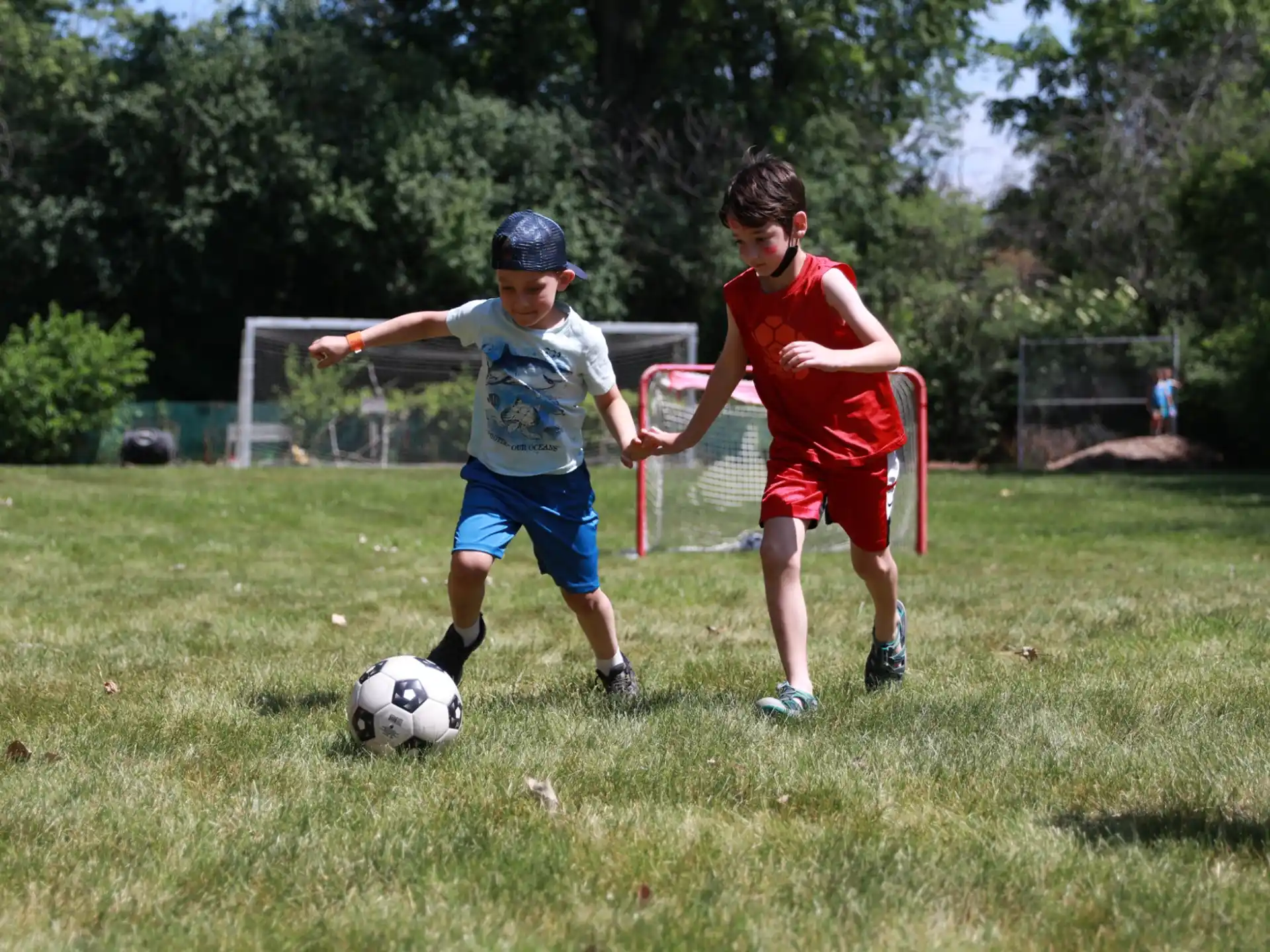 kids playing with a football ball