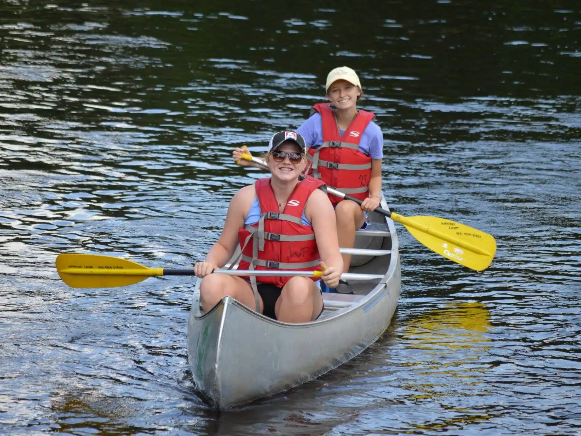 a couple of people in a canoe