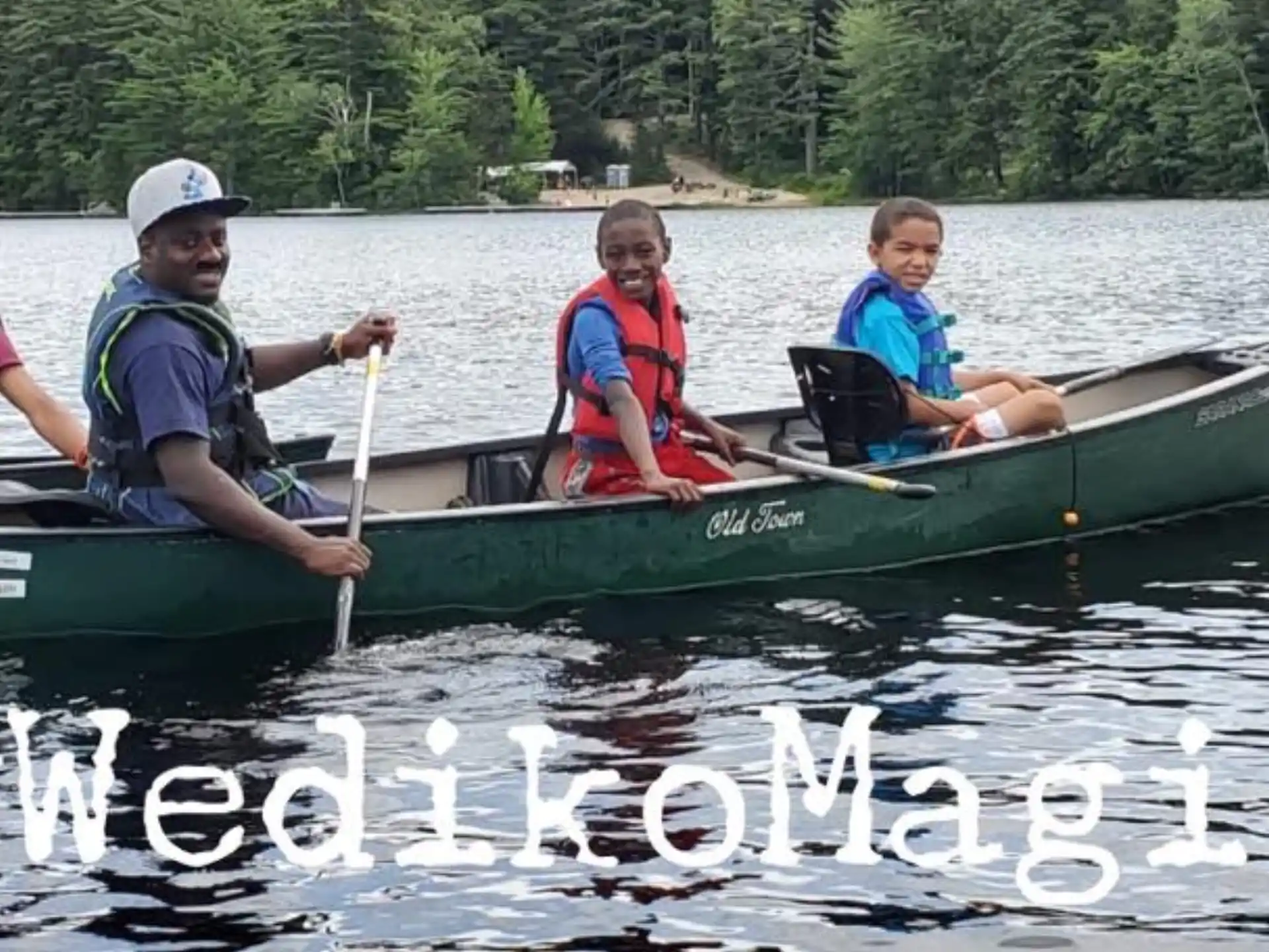 a group of people in a canoe