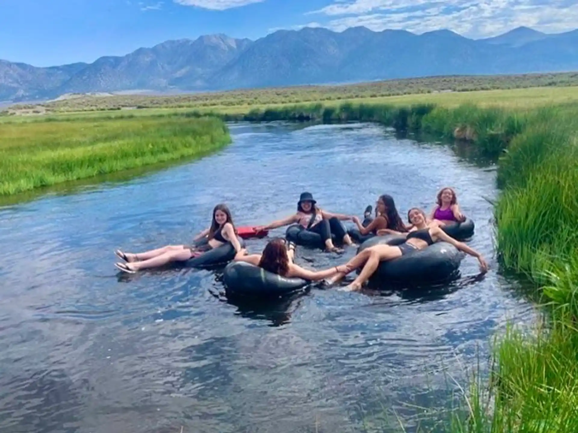 a group of people on a raft in a river