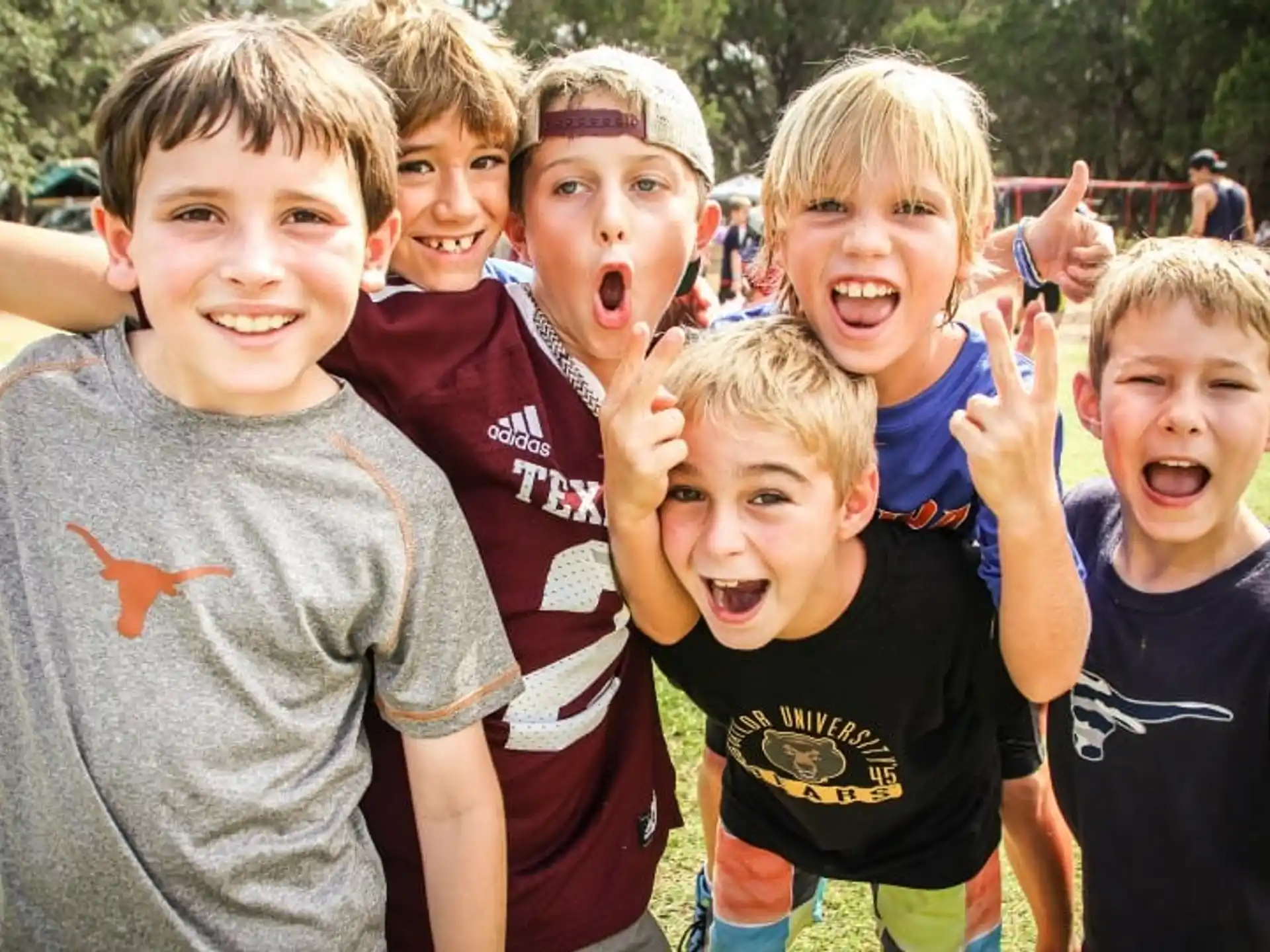 a group of kids posing for a photo