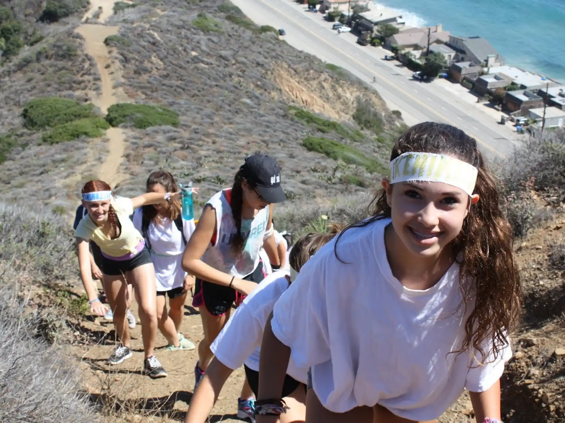 a group of people on a cliff