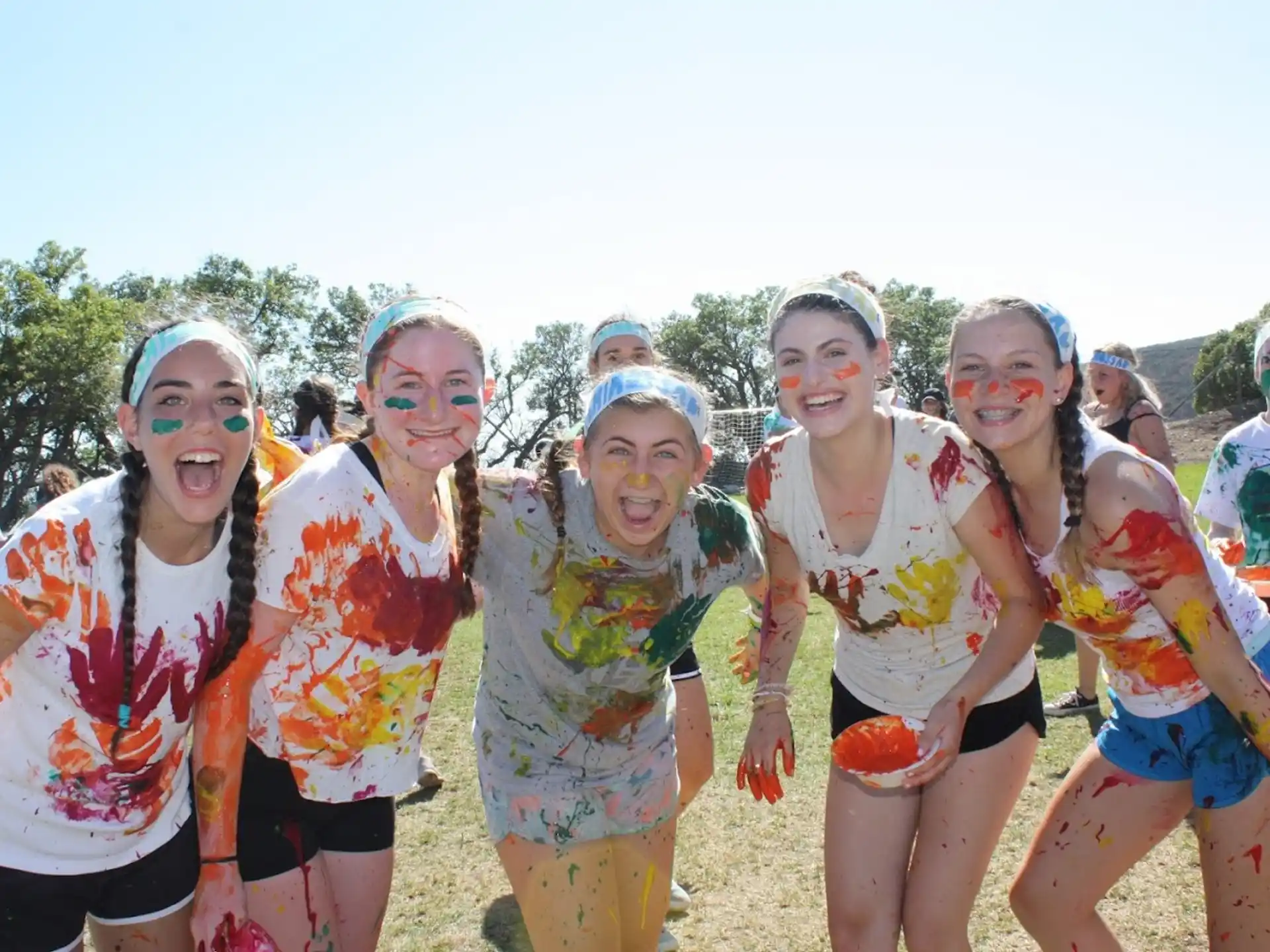 a group of women wearing colorful clothing