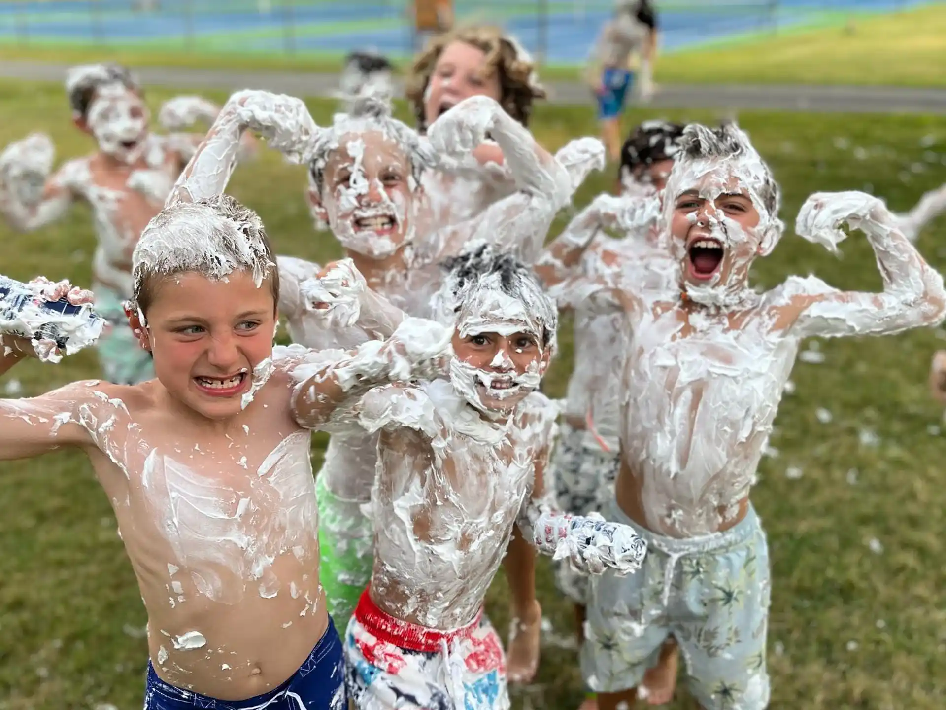 a group of people wearing white and blue clothing