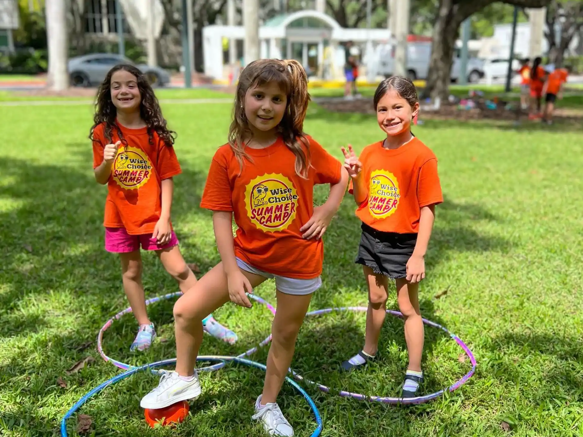 a group of children playing with a hose