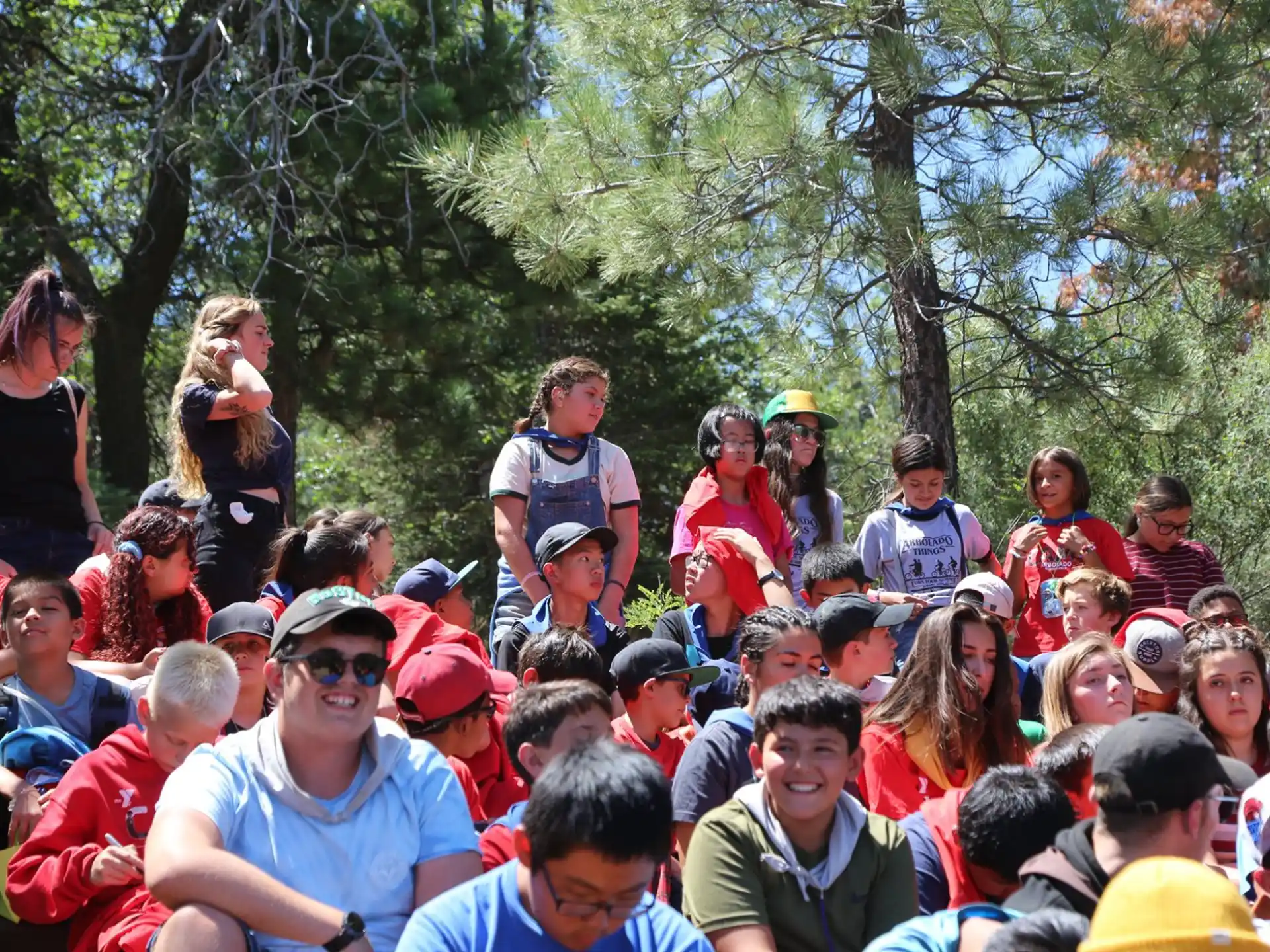 a group of people sitting on the ground