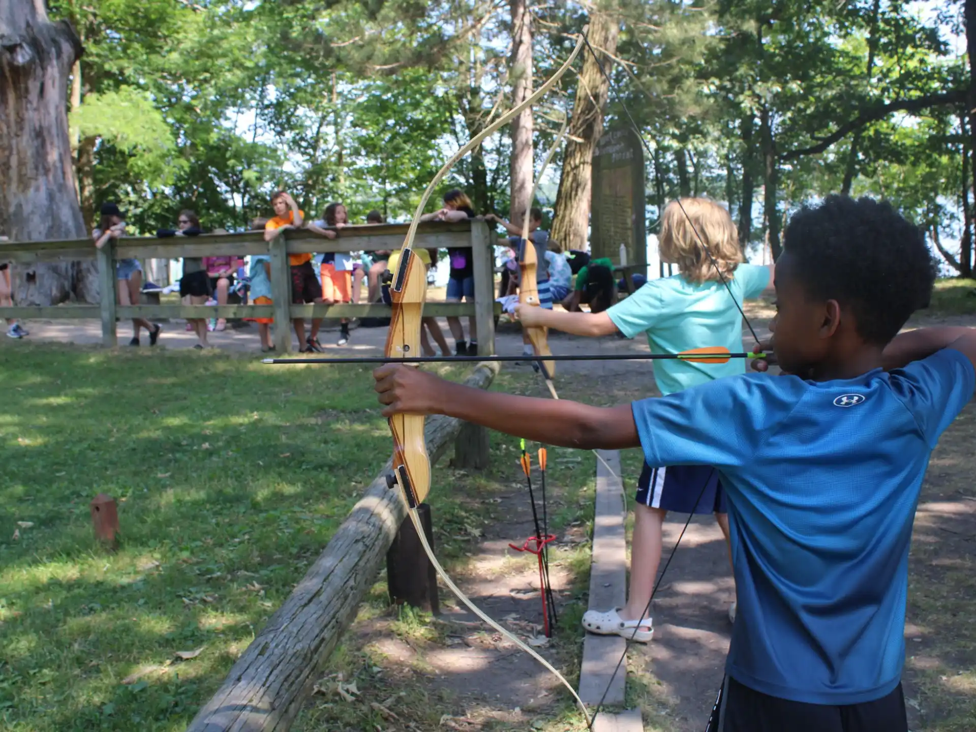 a group of people playing with sticks