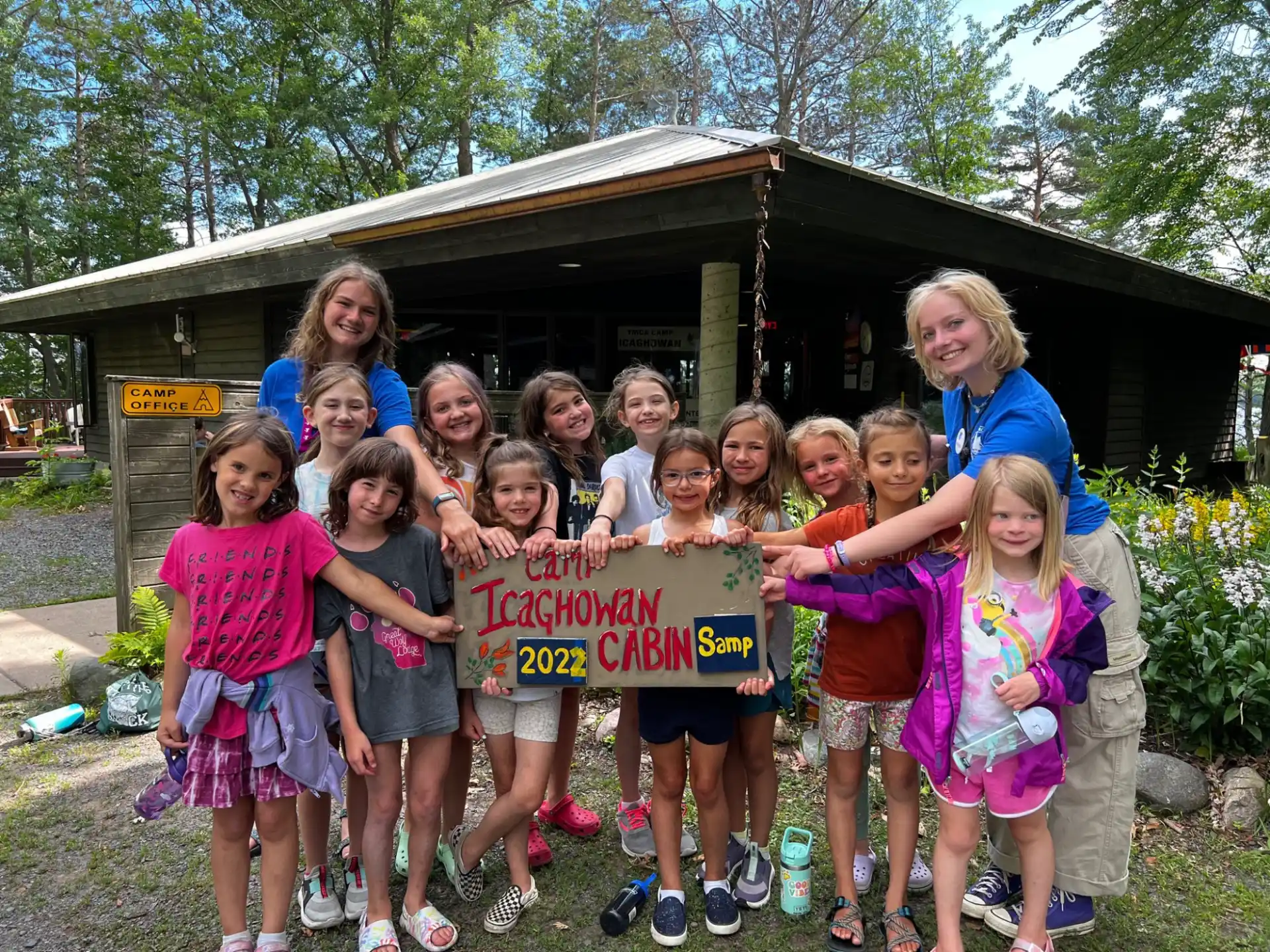 a group of children holding a sign