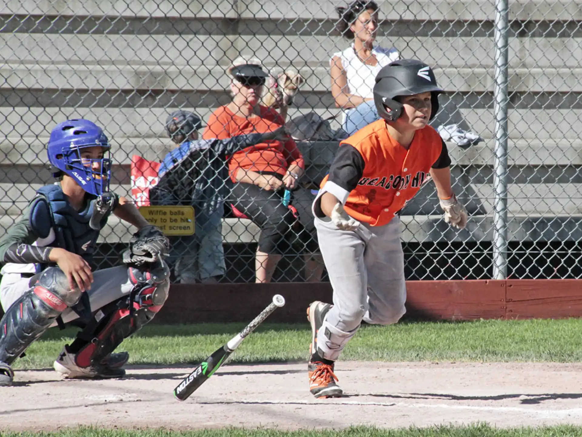 a kid swinging a baseball bat