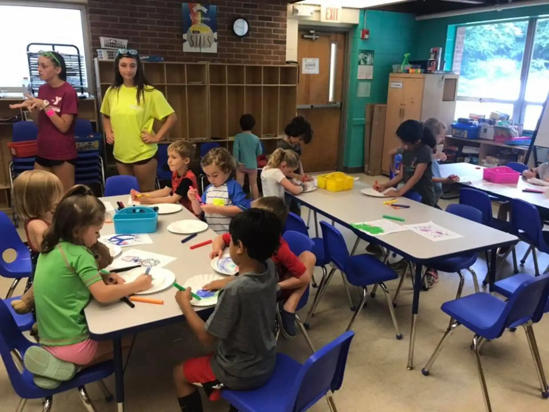 a group of children sitting at tables