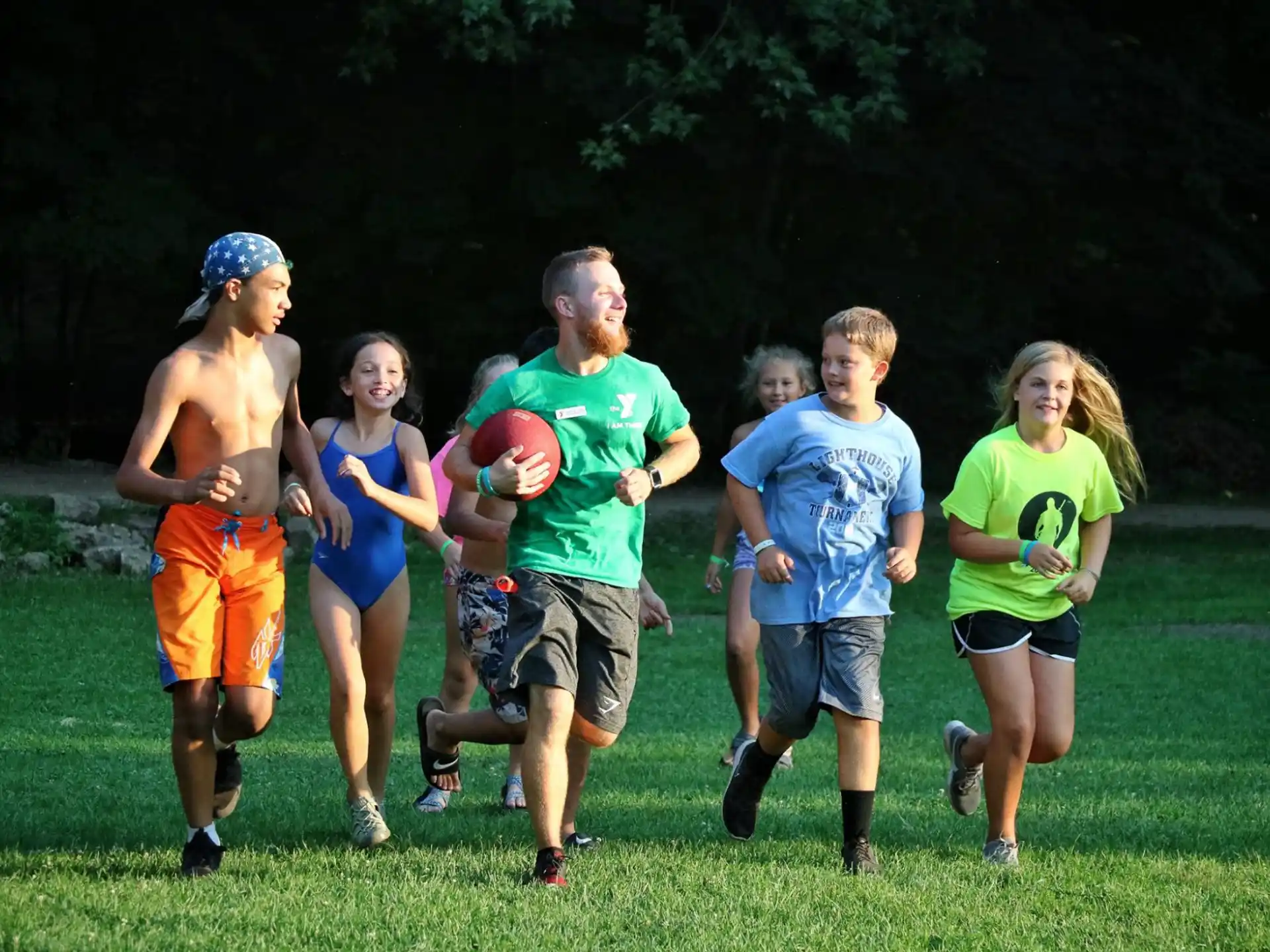 a group of people running on a field