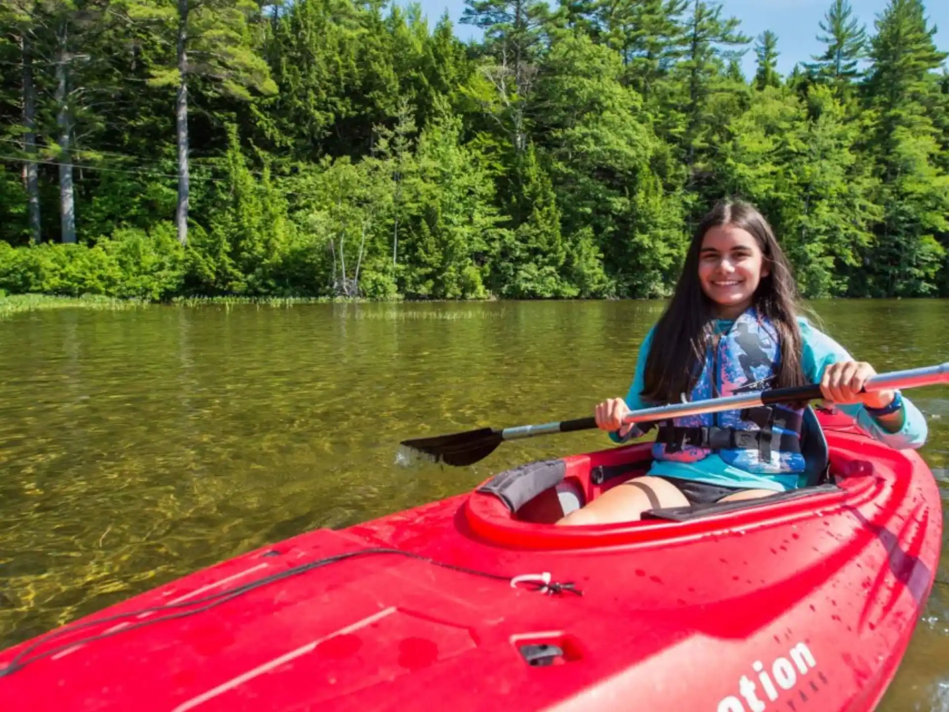 a person in a red kayak