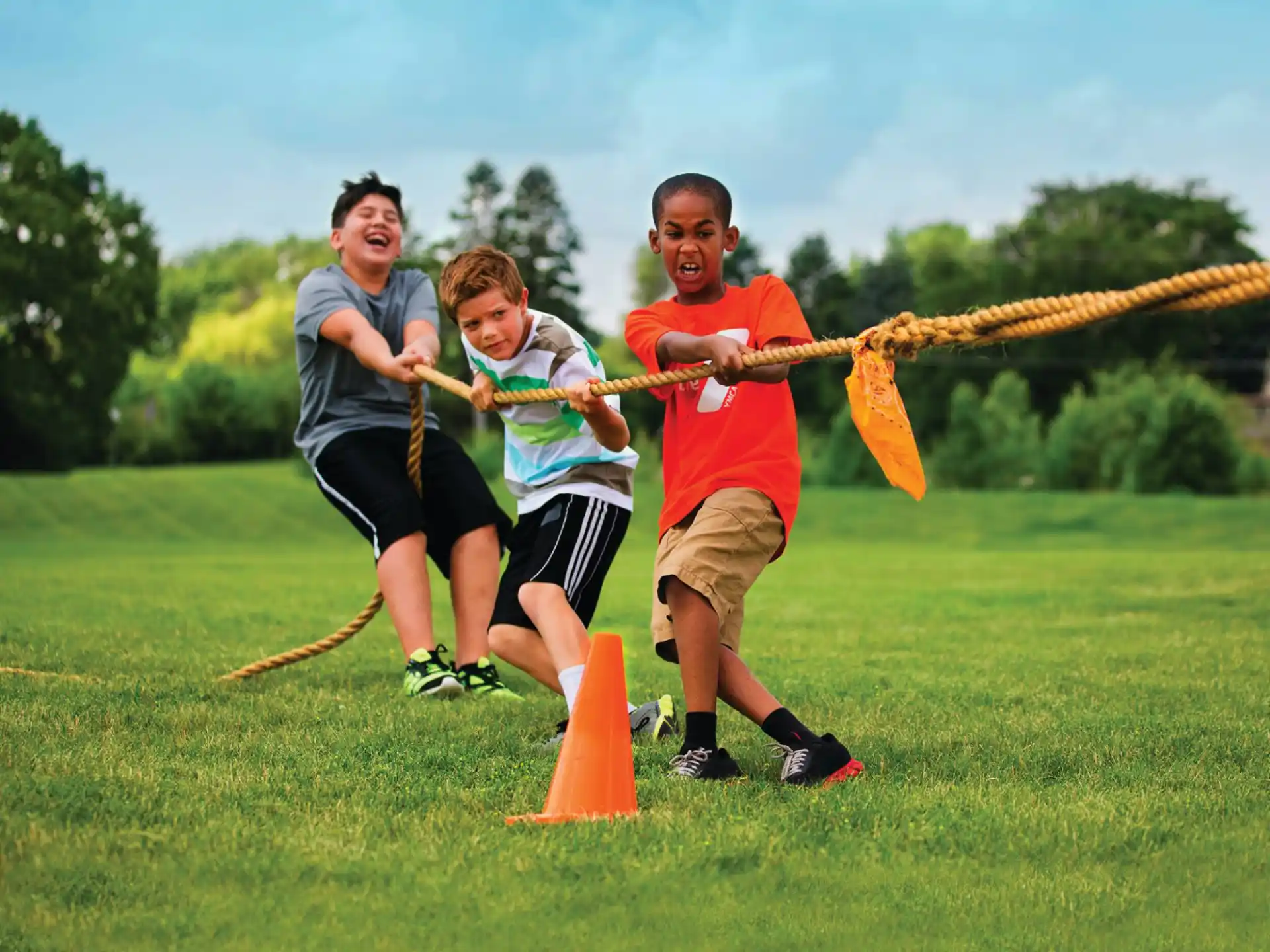 a group of people playing with a bow and arrow
