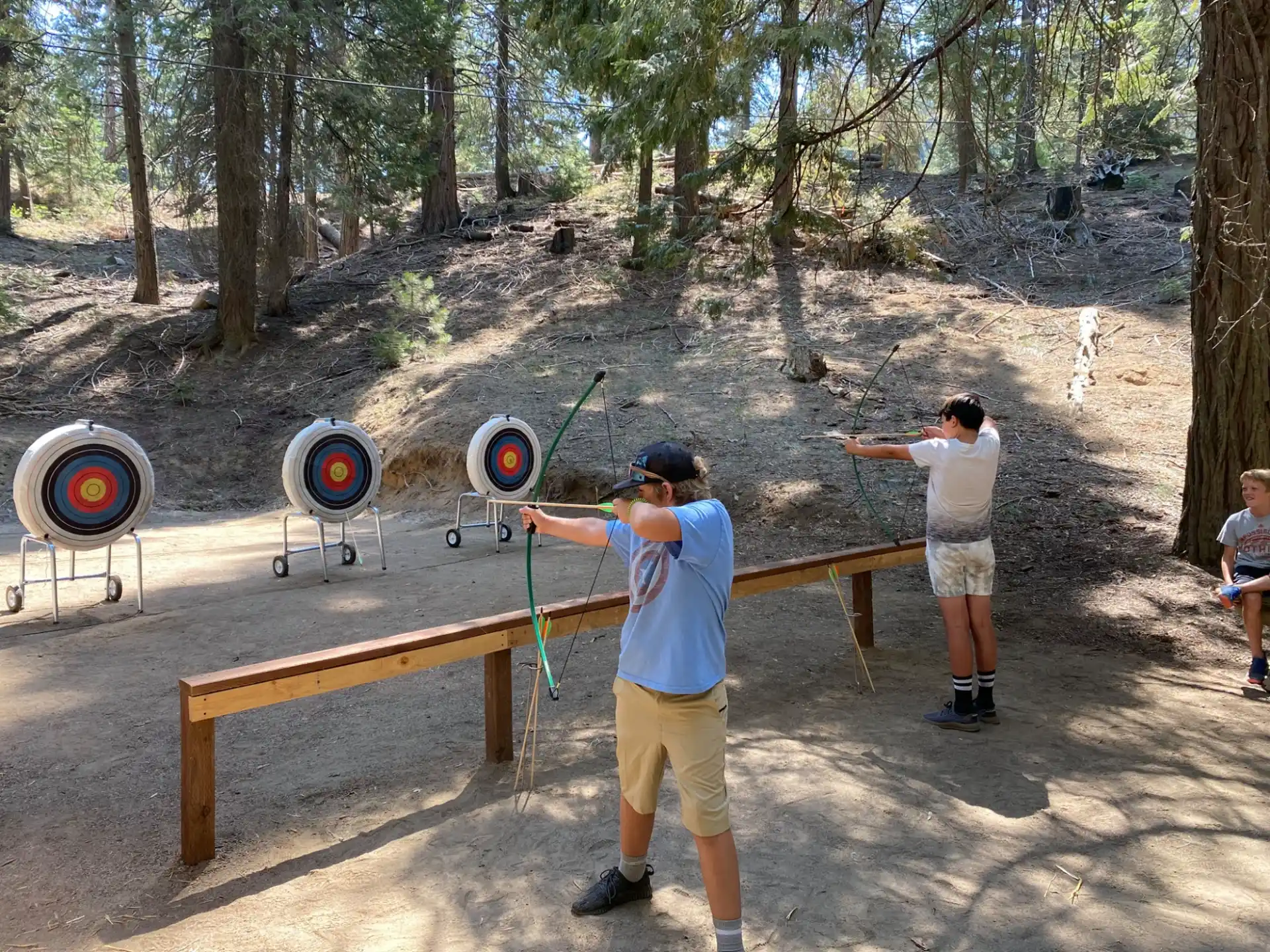 a couple of men shooting arrows