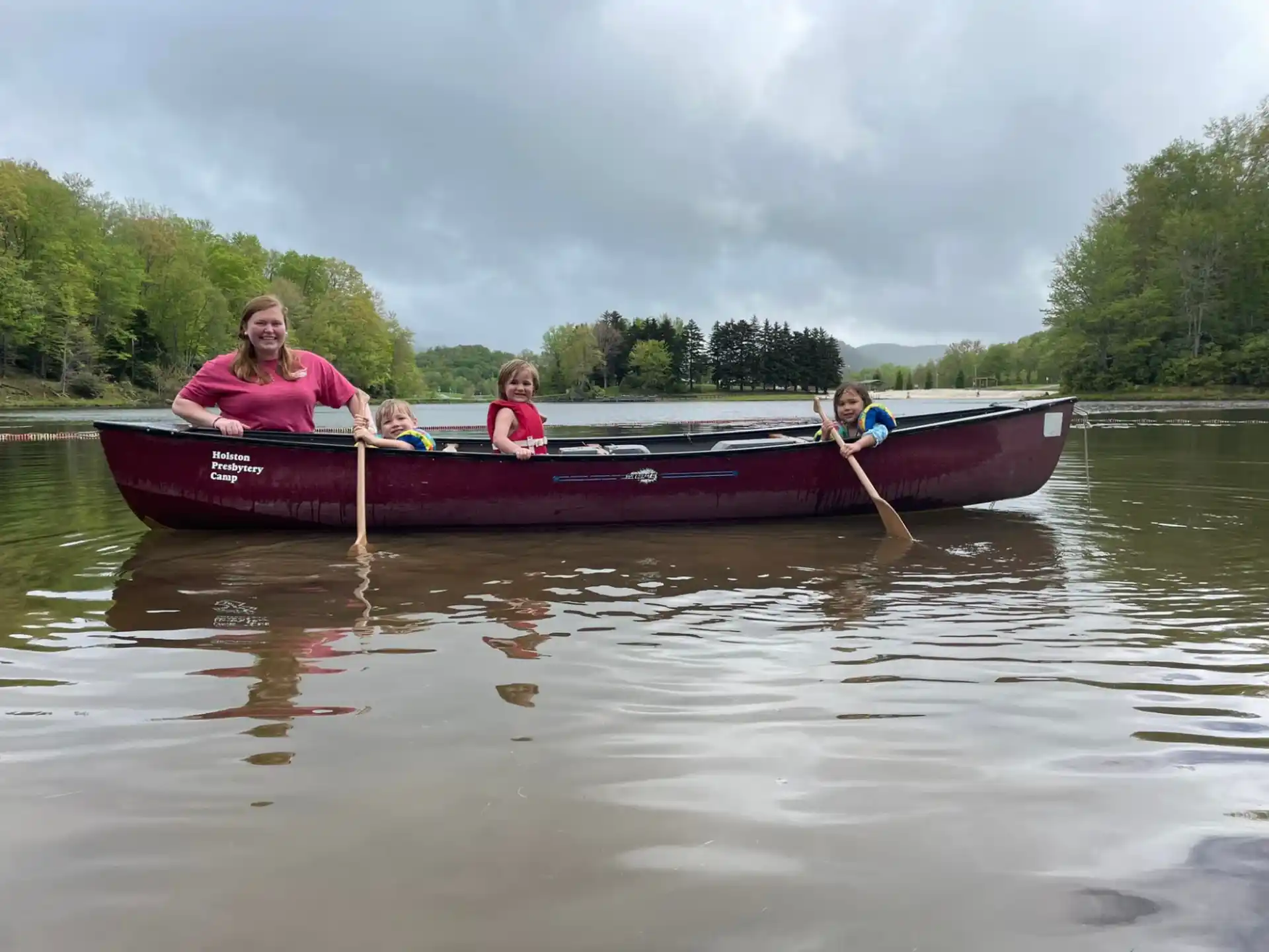 a group of people in a canoe