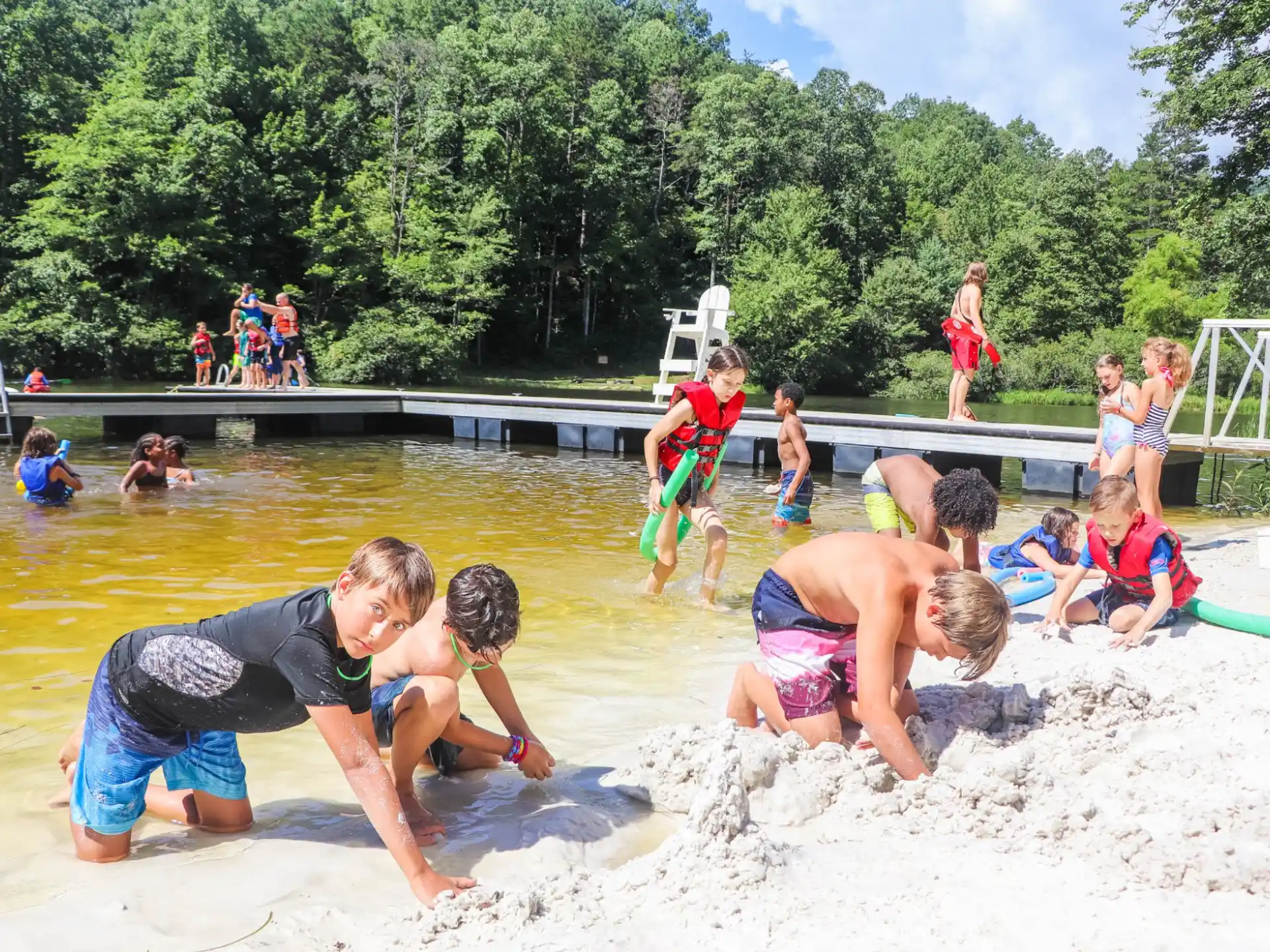 a group of people playing in the water