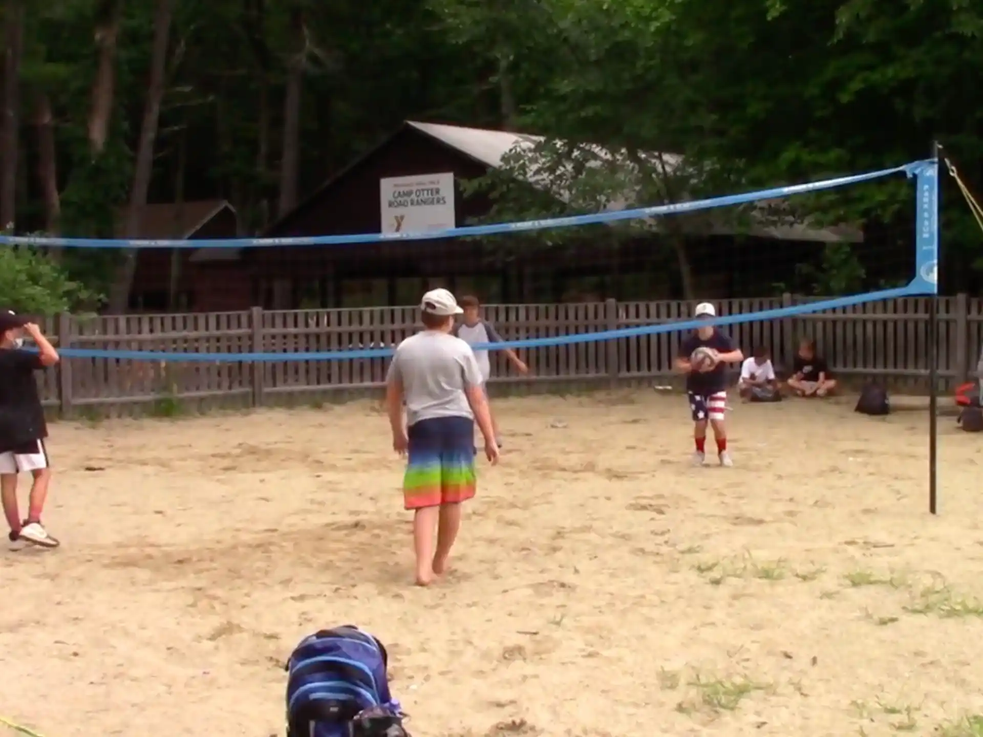 a group of people playing volleyball